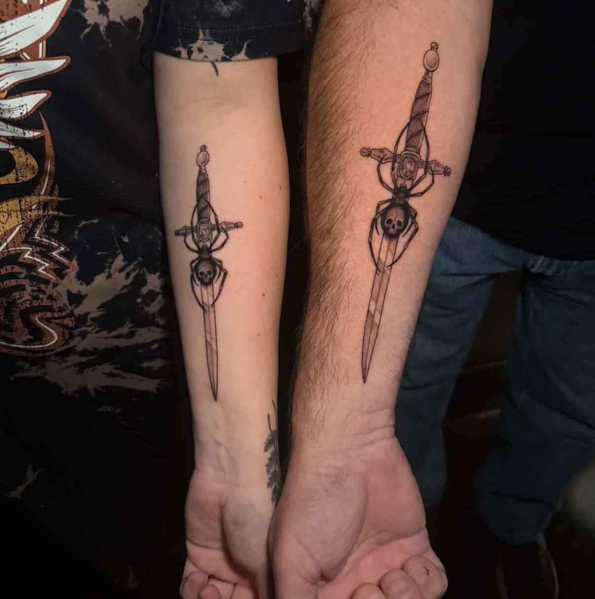 Sword and skull black and grey tattoo on the forearm by Lauren B