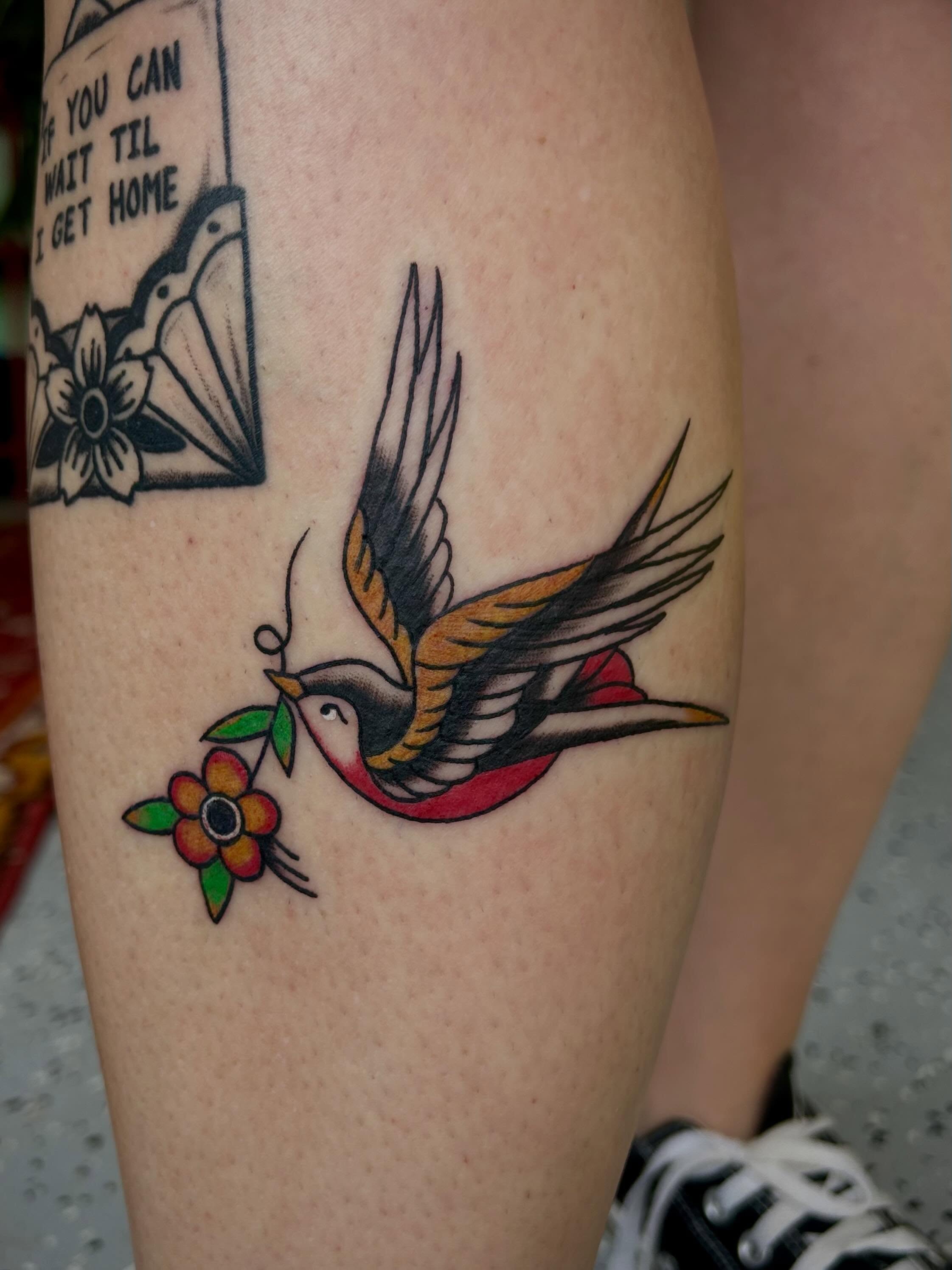Bird and flower American traditional tattoo on the forearm by Bria🩸