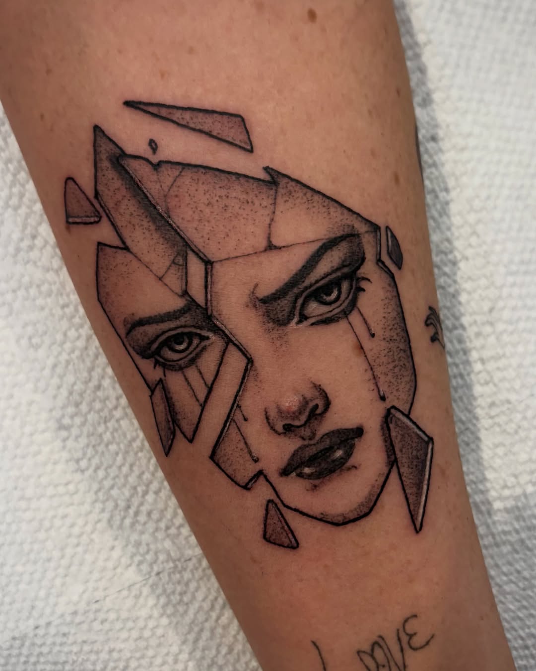 Geometric portrait geometric tattoo on the forearm by Tara, Exeter, Pennsylvania