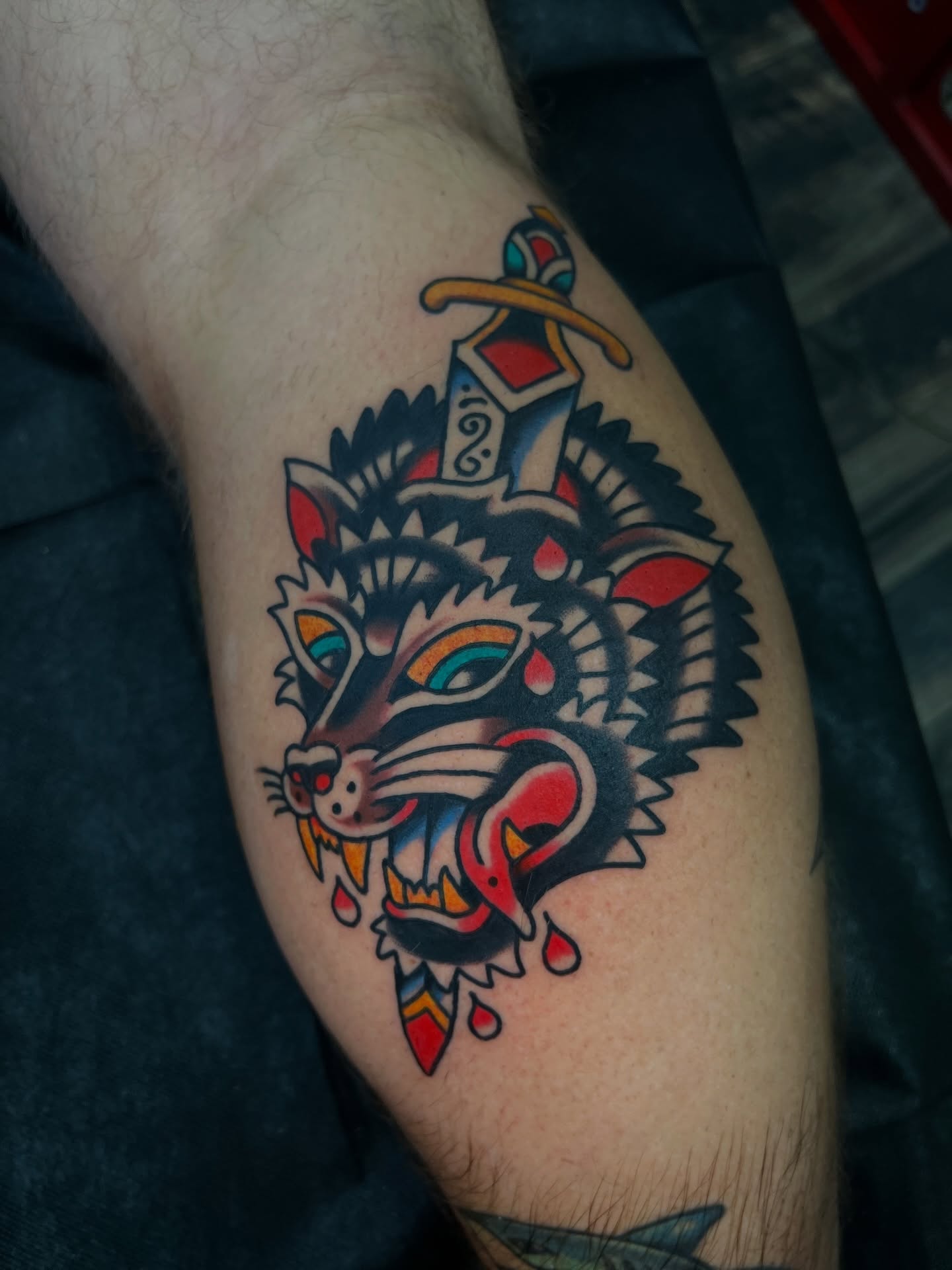 Wolf and sword American traditional tattoo on the forearm by 🍊Harvey Perez 🍊, Deerfield Beach, Florida