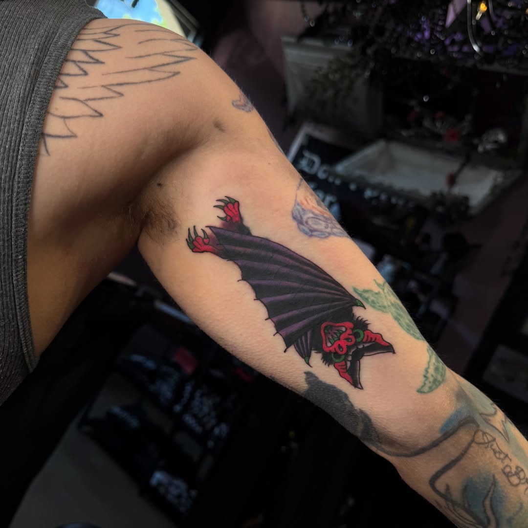Bat dark realism tattoo on the forearm by Mercy Dean