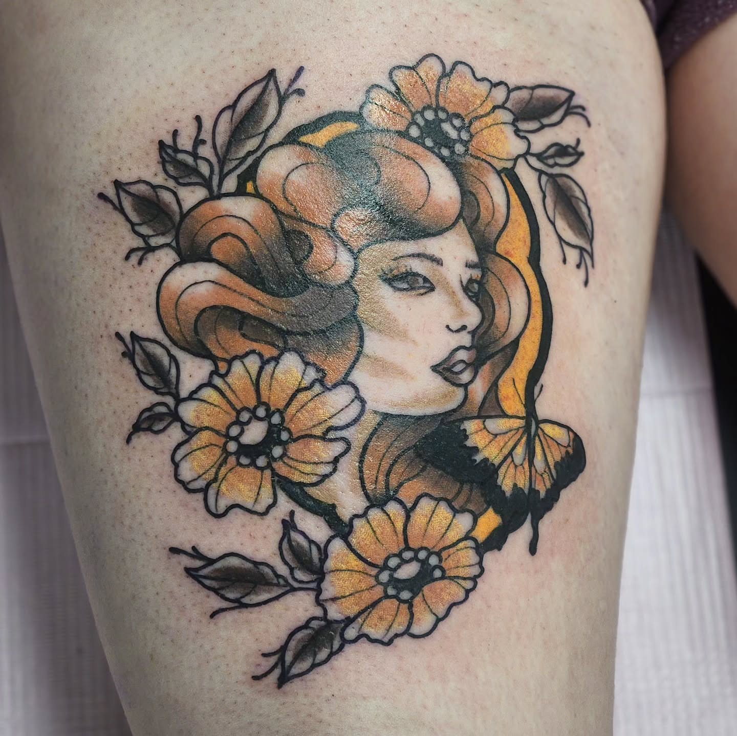 Woman with flowers American traditional tattoo on the thigh by Sonya ๐ฟ๐ธ๐พ