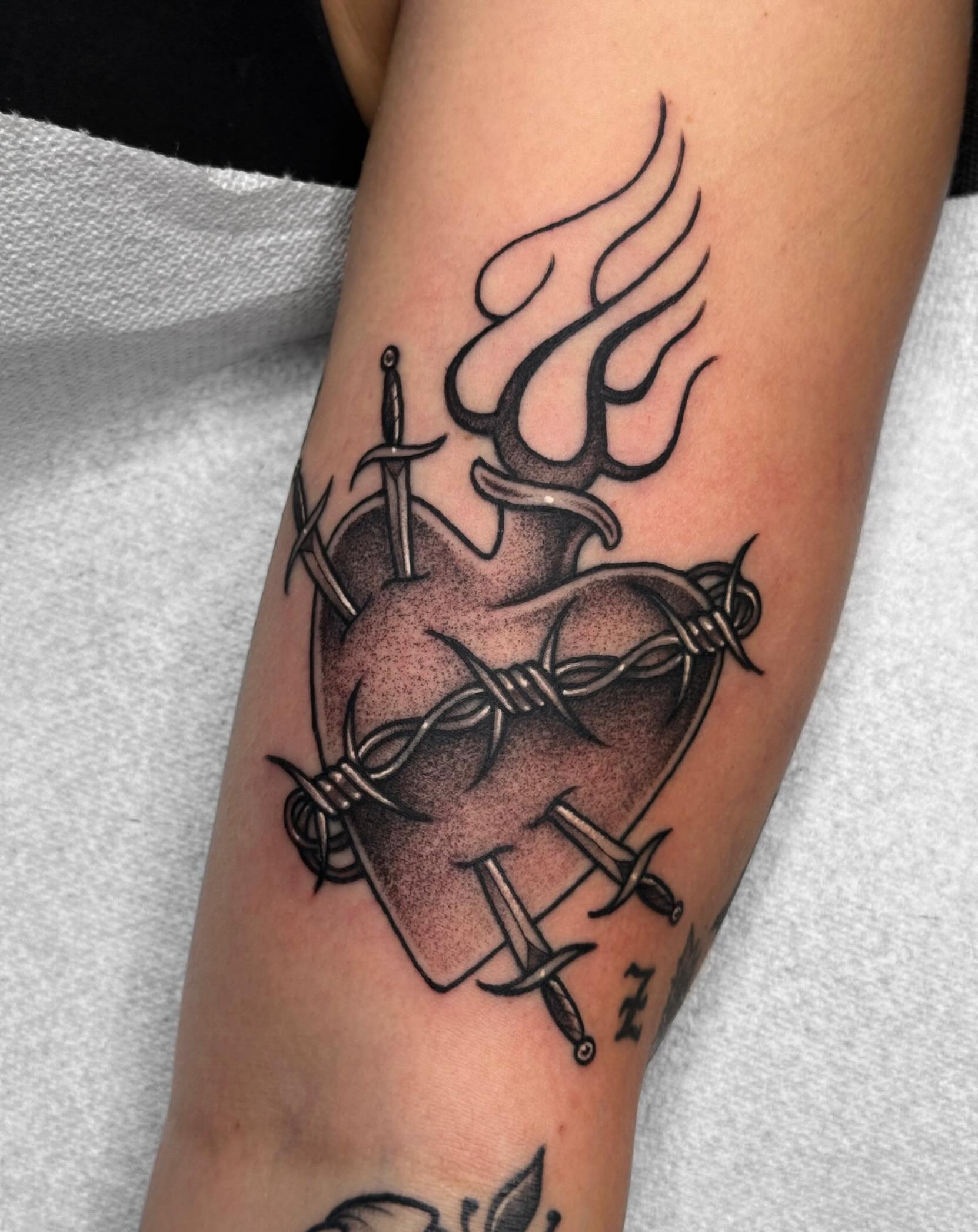Heart with barbed wire and swords neo-traditional tattoo on the forearm by ☠︎ Mikayla Benson  ☠︎
