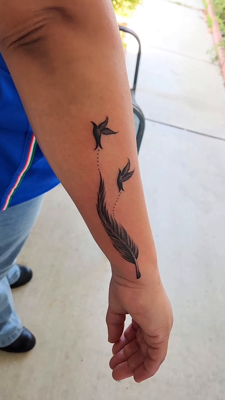 Feather and birds tattoo fine line tattoo on the forearm by @youxg_guxxz
