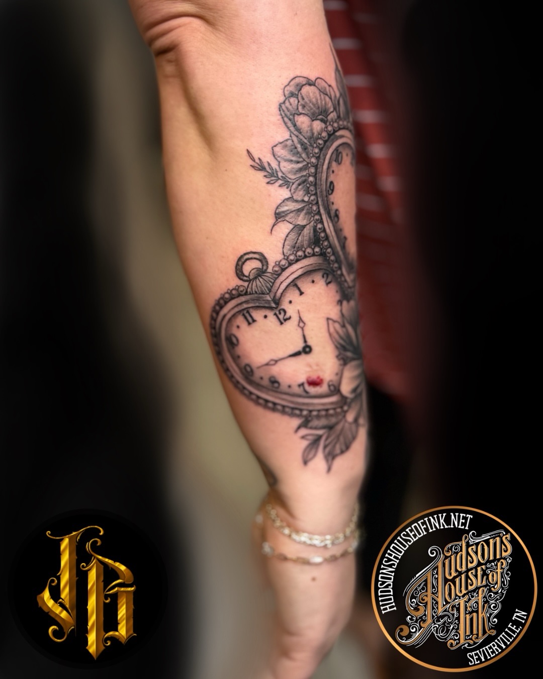 Clock and floral realism tattoo on the forearm by James Brooks