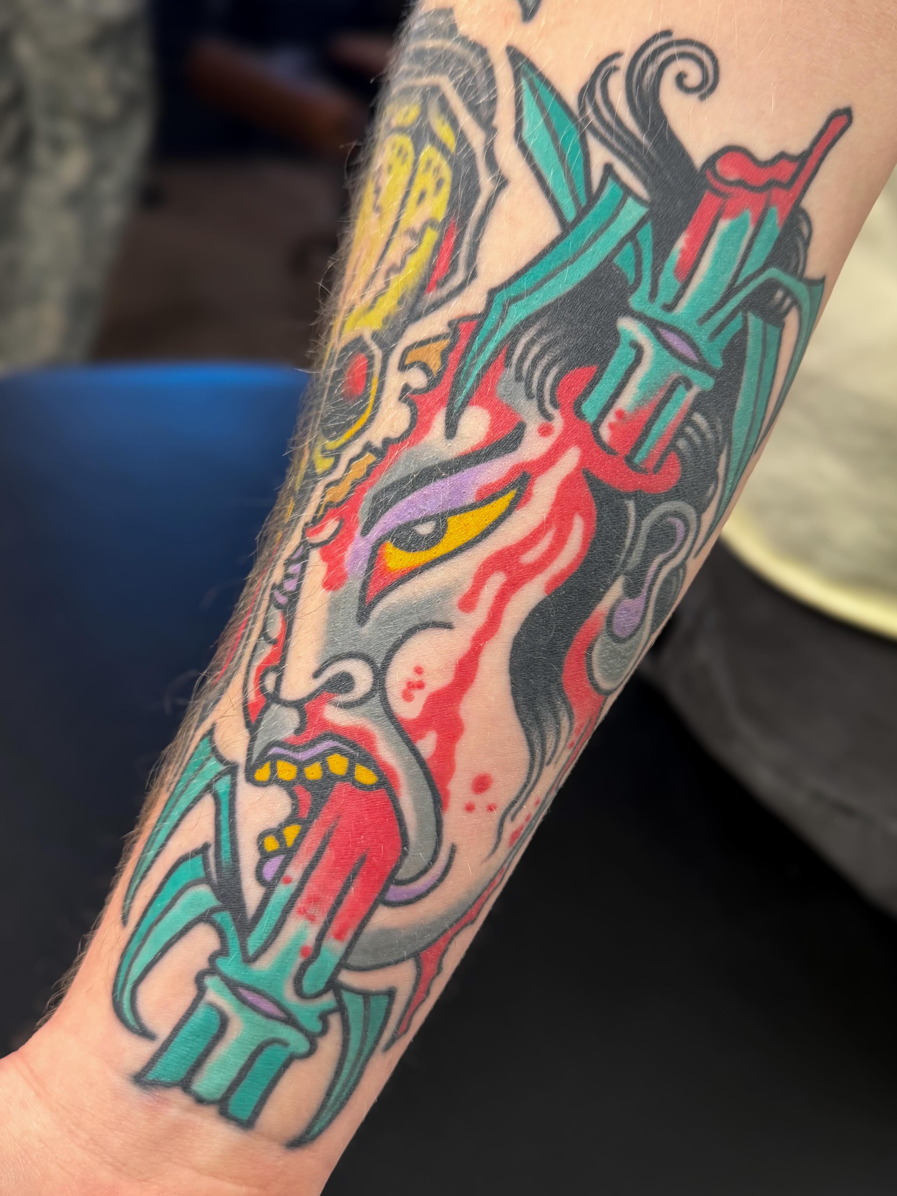 Mask American traditional tattoo on the forearm by Danny Reed, Asheville, North Carolina