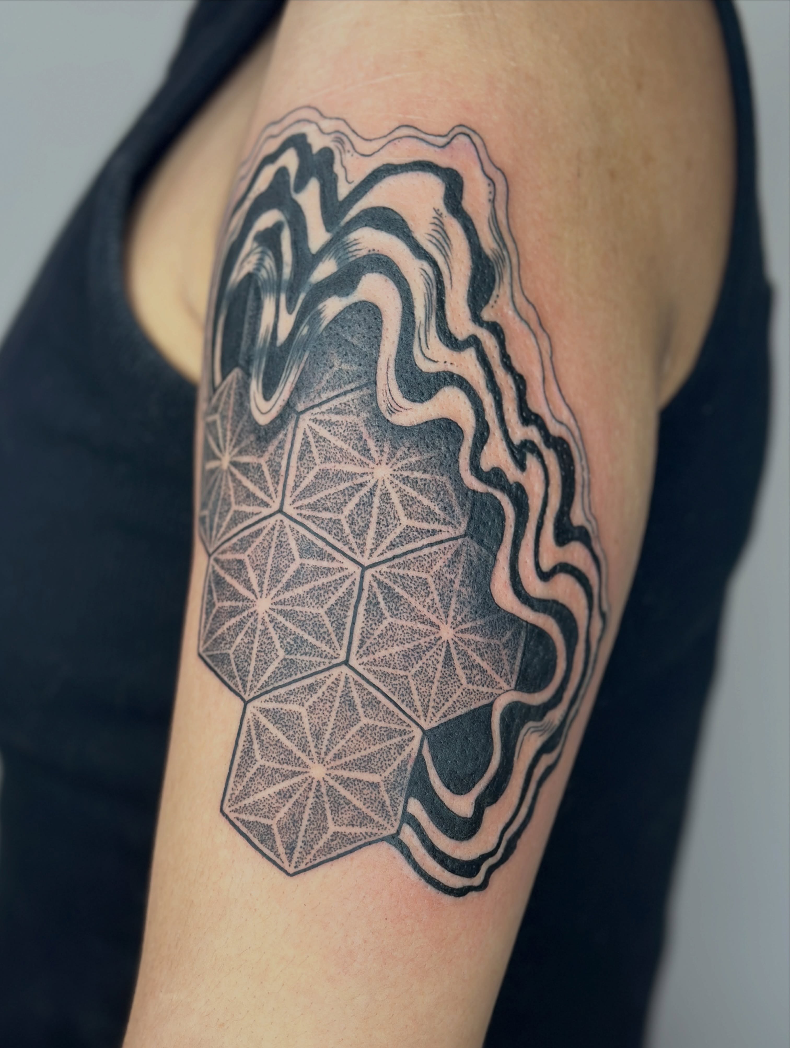 Geometric pattern dotwork tattoo on the upper arm by Gabrielle Brodman 🎀 Raleigh-Durham Tattoo
