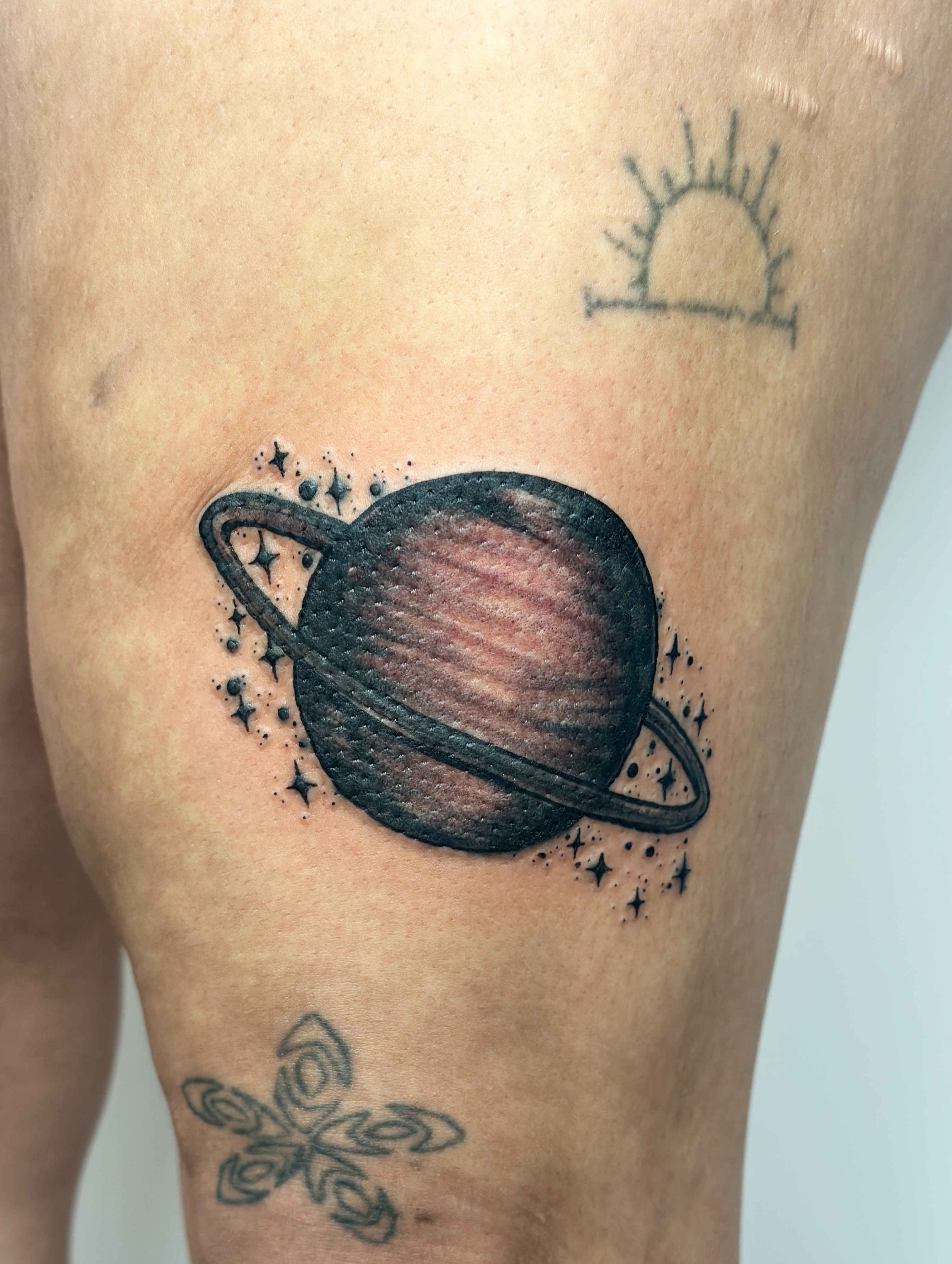Saturn dotwork tattoo on the thigh by Gabrielle Brodman 🎀 Raleigh-Durham Tattoo