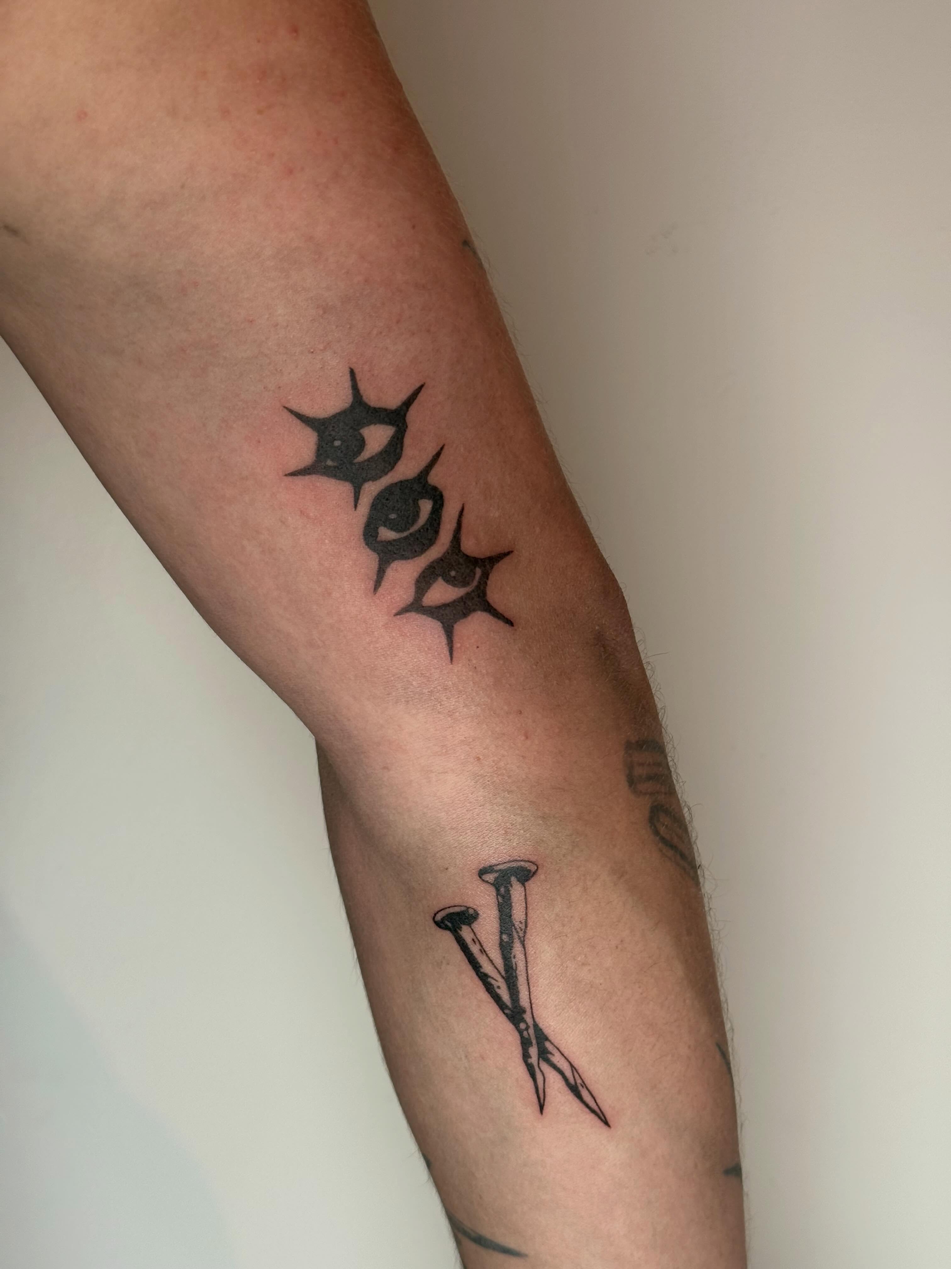 Spiked letters black and grey tattoo on the forearm by TATTOO & PIERCING ARTIST ₊˚⊹ ᰔ