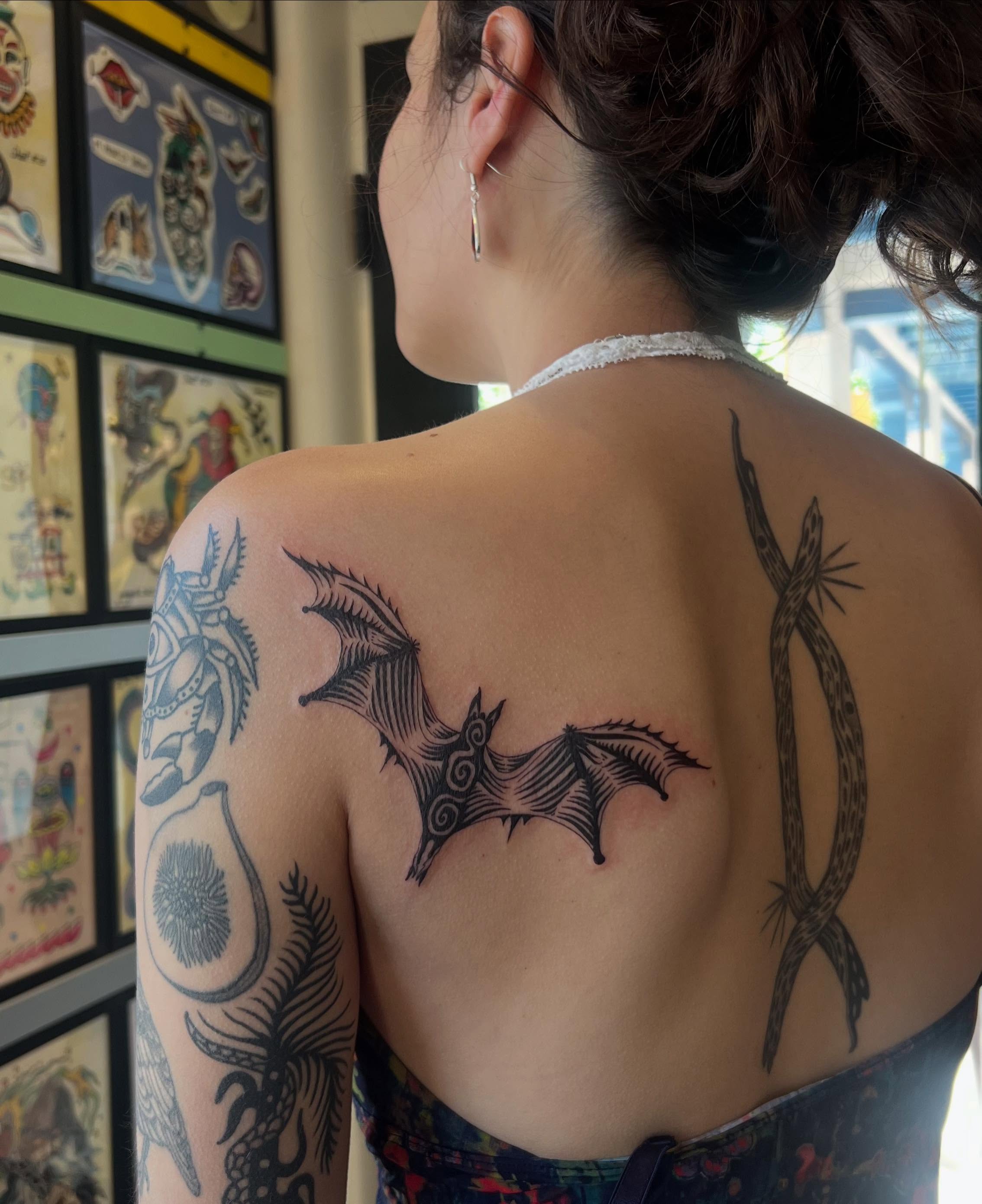 Bat black and grey tattoo on the back by Alex