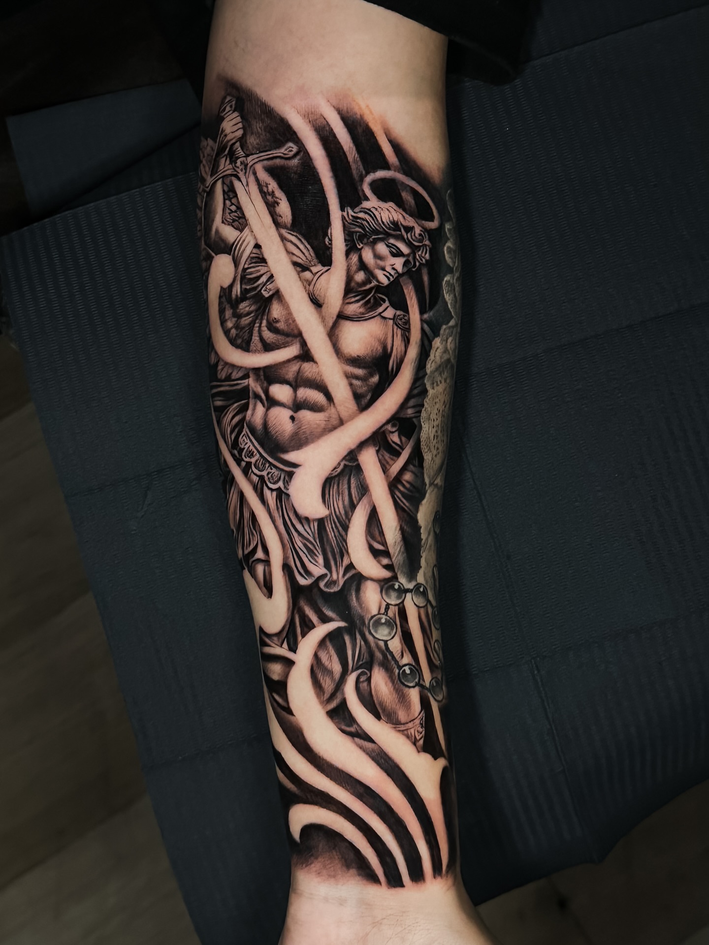 Angel with sword realism tattoo on the forearm by Omar Sheriff Herrera