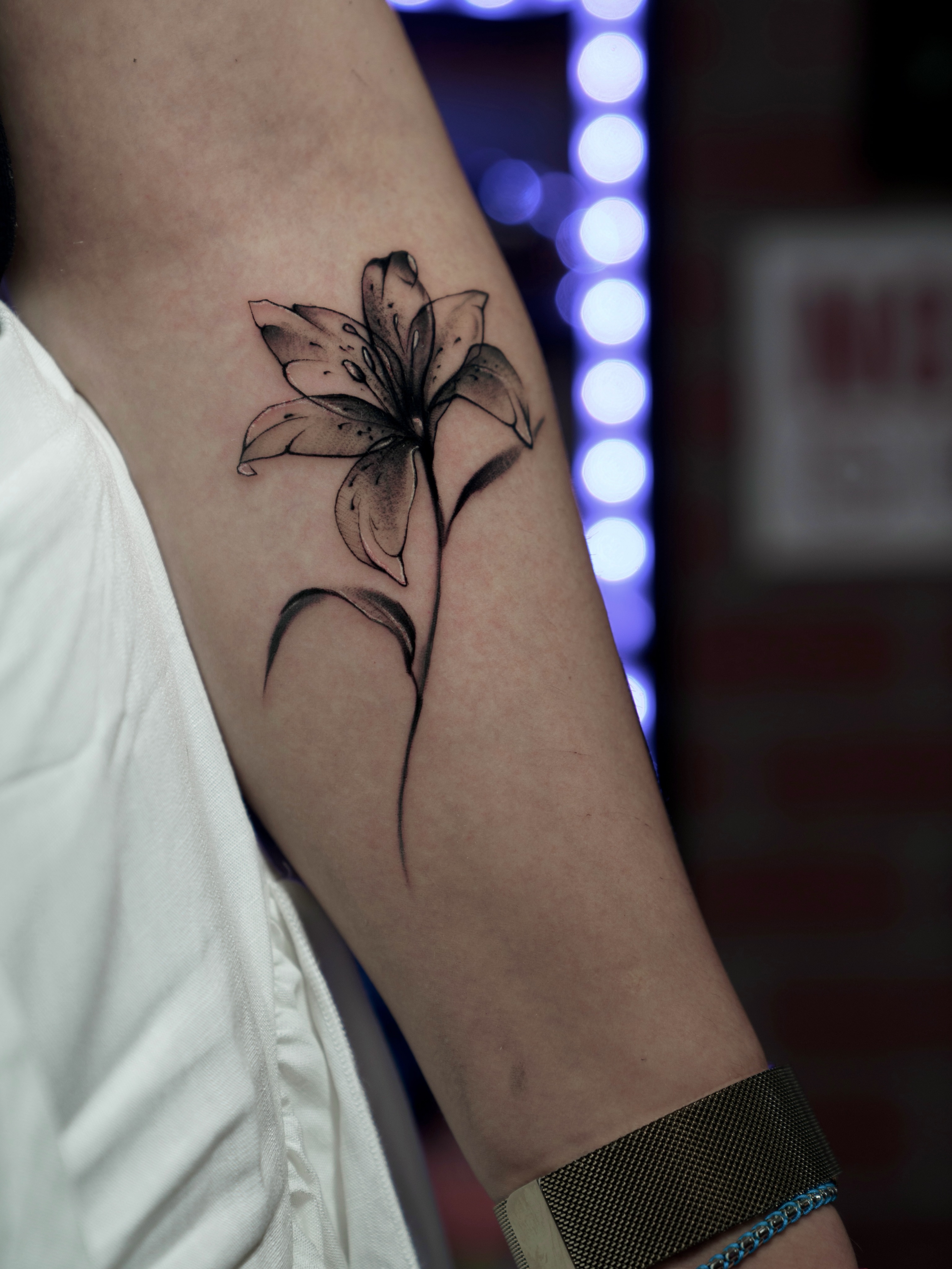 Lily black and grey tattoo on the forearm by Keyla Valdes, Miami, Florida