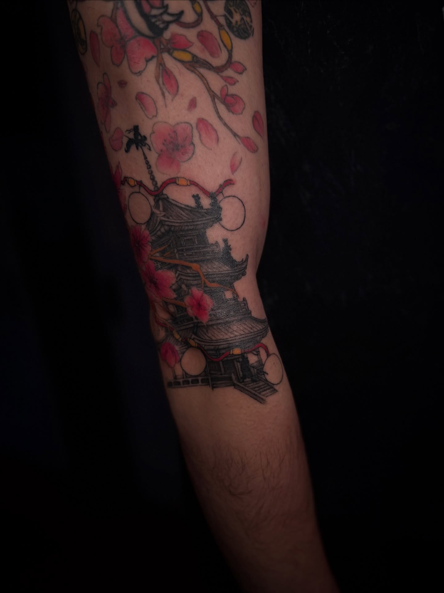 Cherry blossoms and pagoda japanese irezumi tattoo on the forearm by Gianna G