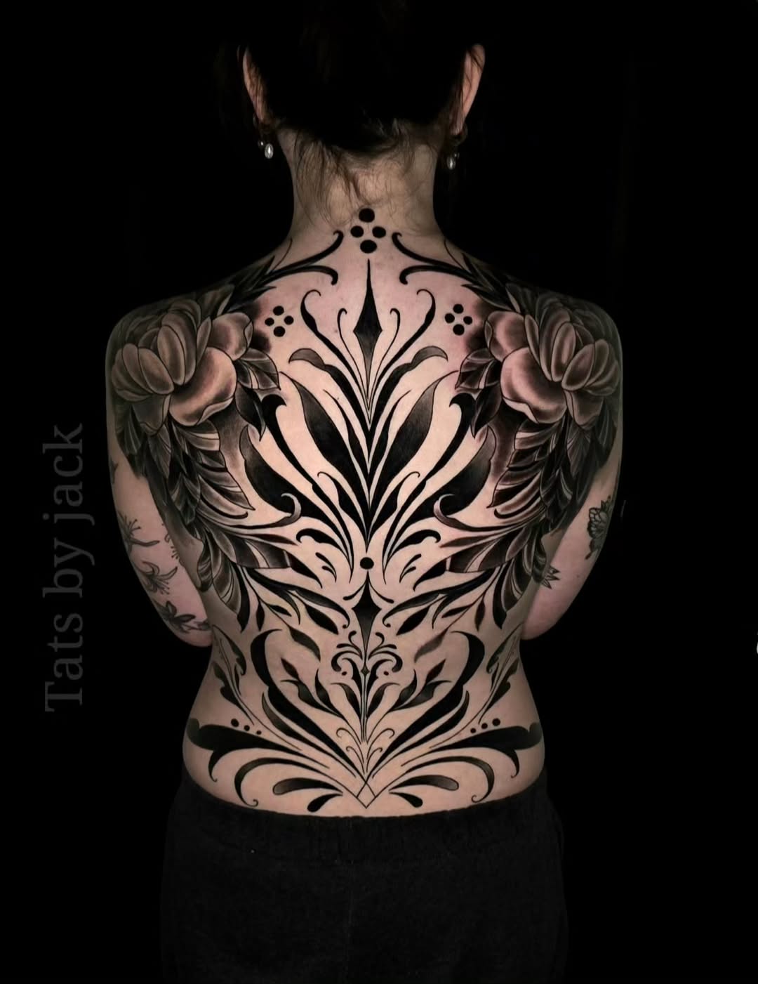 Ornamental back piece with floral elements tribal tattoo on the back by Jack Daniel Knowlden