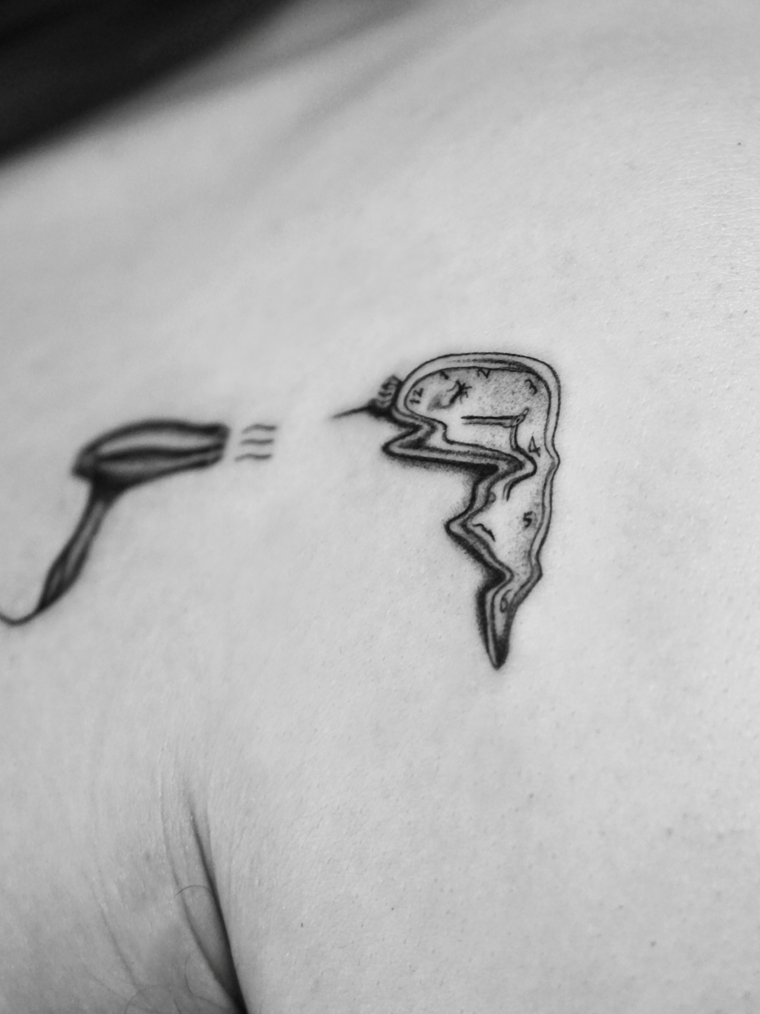 Clock and pipe black and grey tattoo on the shoulder by Metin Karaatli