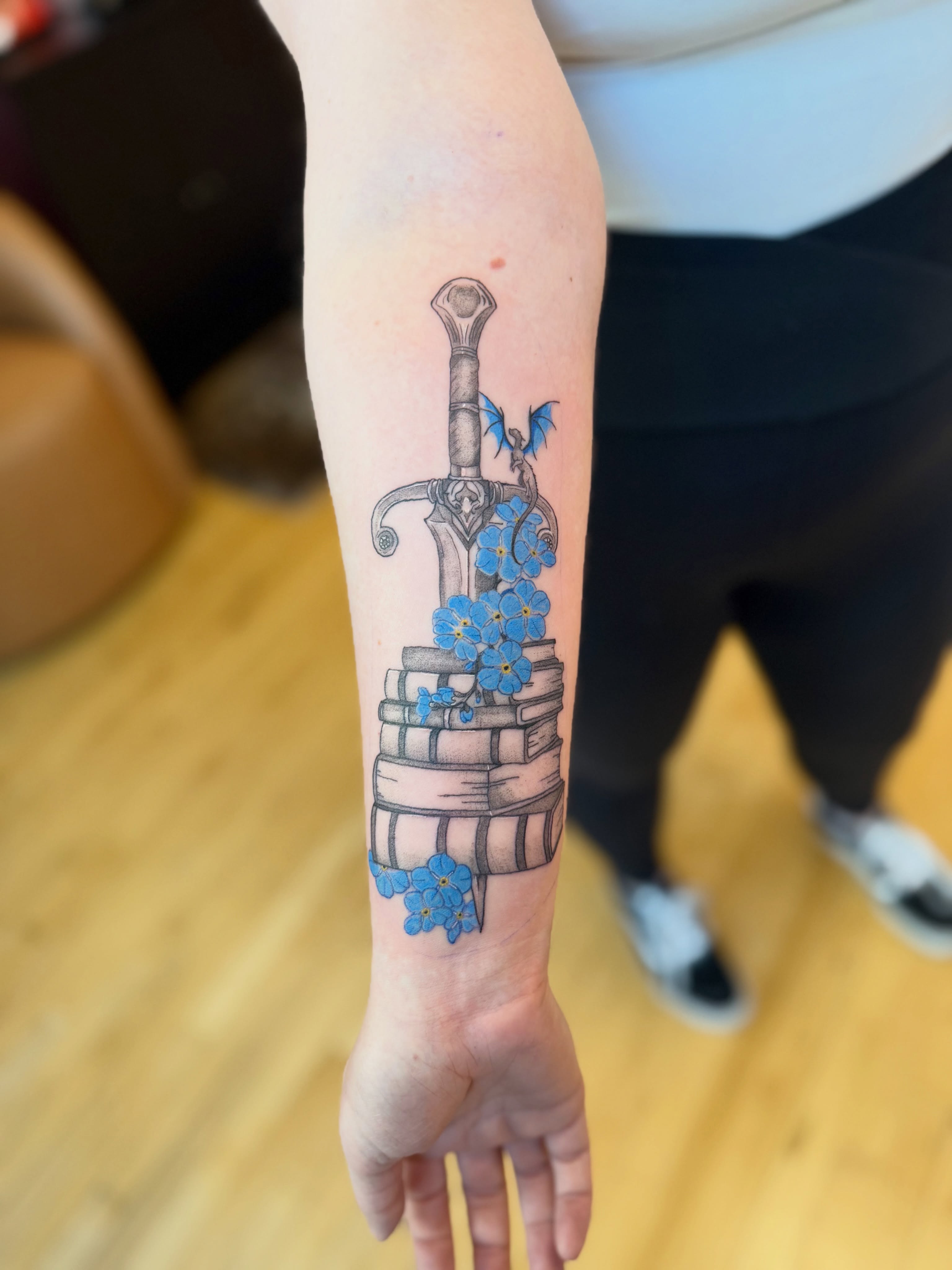 Sword and flowers new school tattoo on the forearm by Kelsey Lynn▪️Raleigh Tattoo Artist