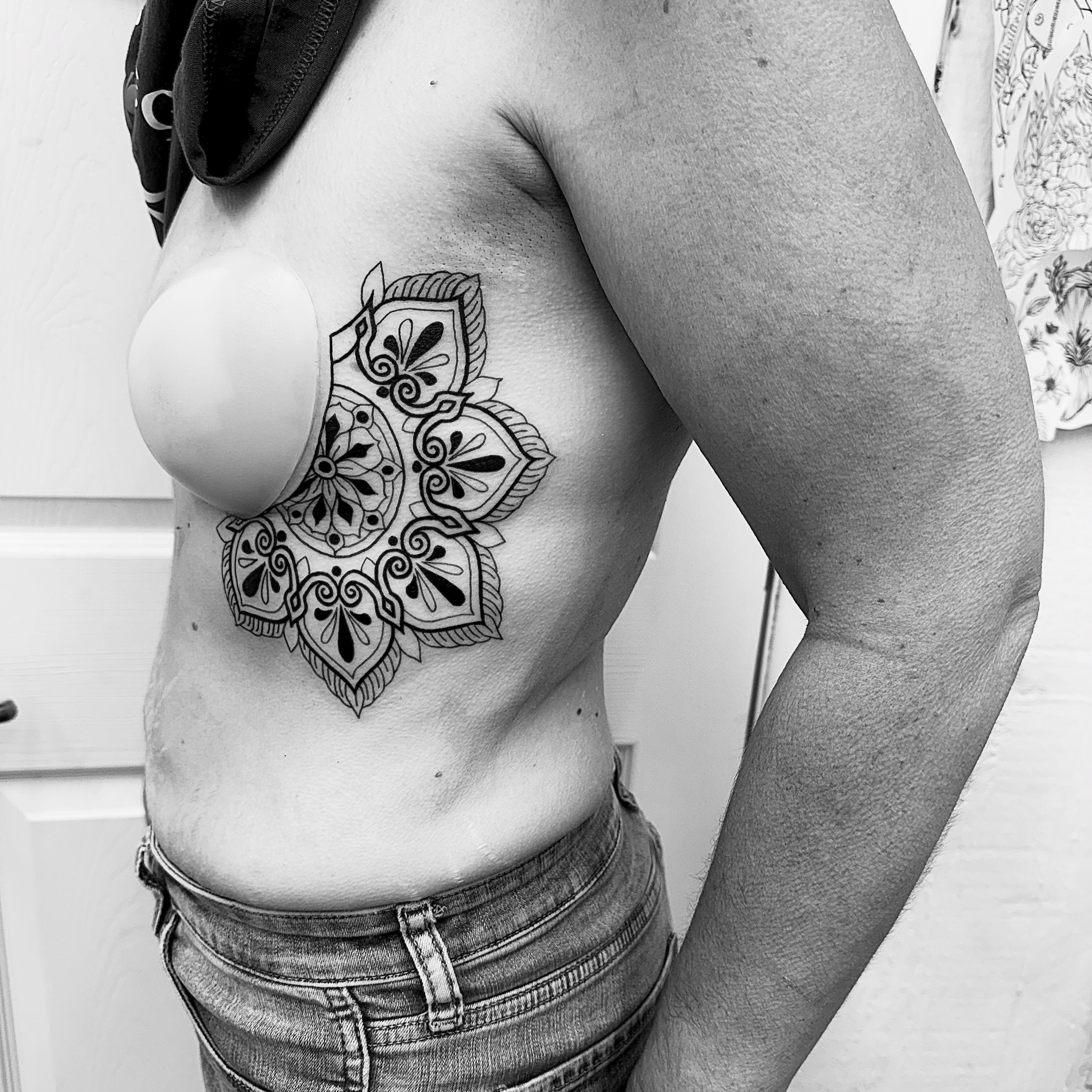 Mandala ornamental tattoo on the chest by Abby Ash, Belington, West Virginia