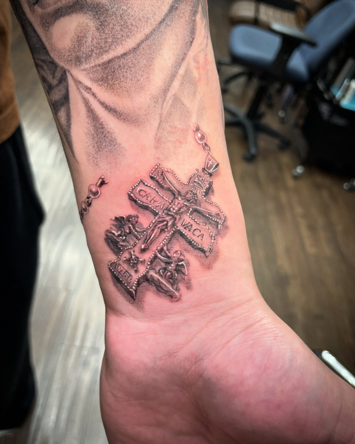 Religious cross realism tattoo on the forearm by Chato