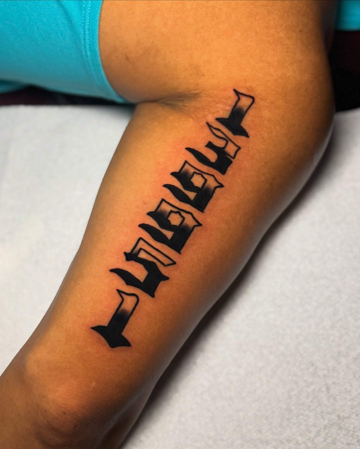 Lettering lettering script tattoo on the forearm by Javin Klingelhoefer Mosley