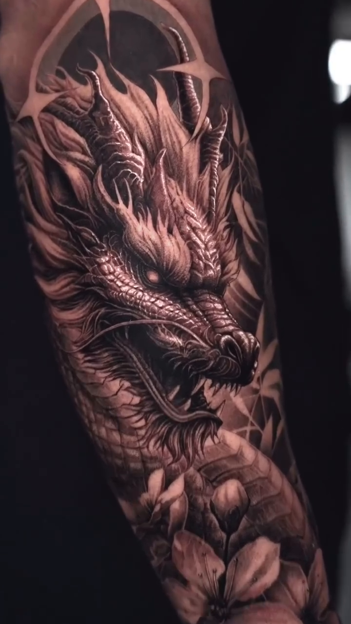 Dragon with flowers Japanese tattoo on the forearm by Sumok Kim