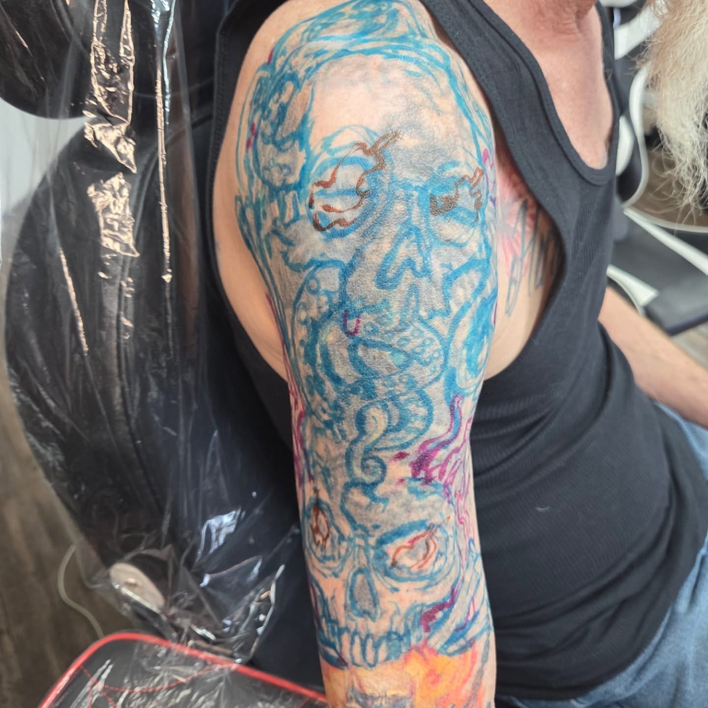 Abstract skull dotwork tattoo on the upper arm by Matthew Todd Kremer