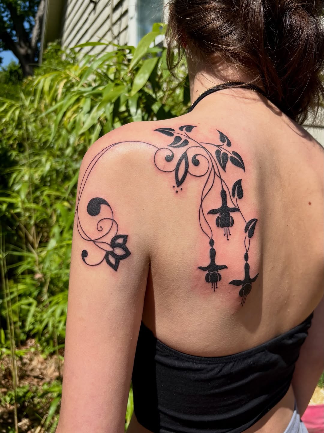 Fuchsia flowers and vine dotwork tattoo on the shoulder by Olivia D’Amore