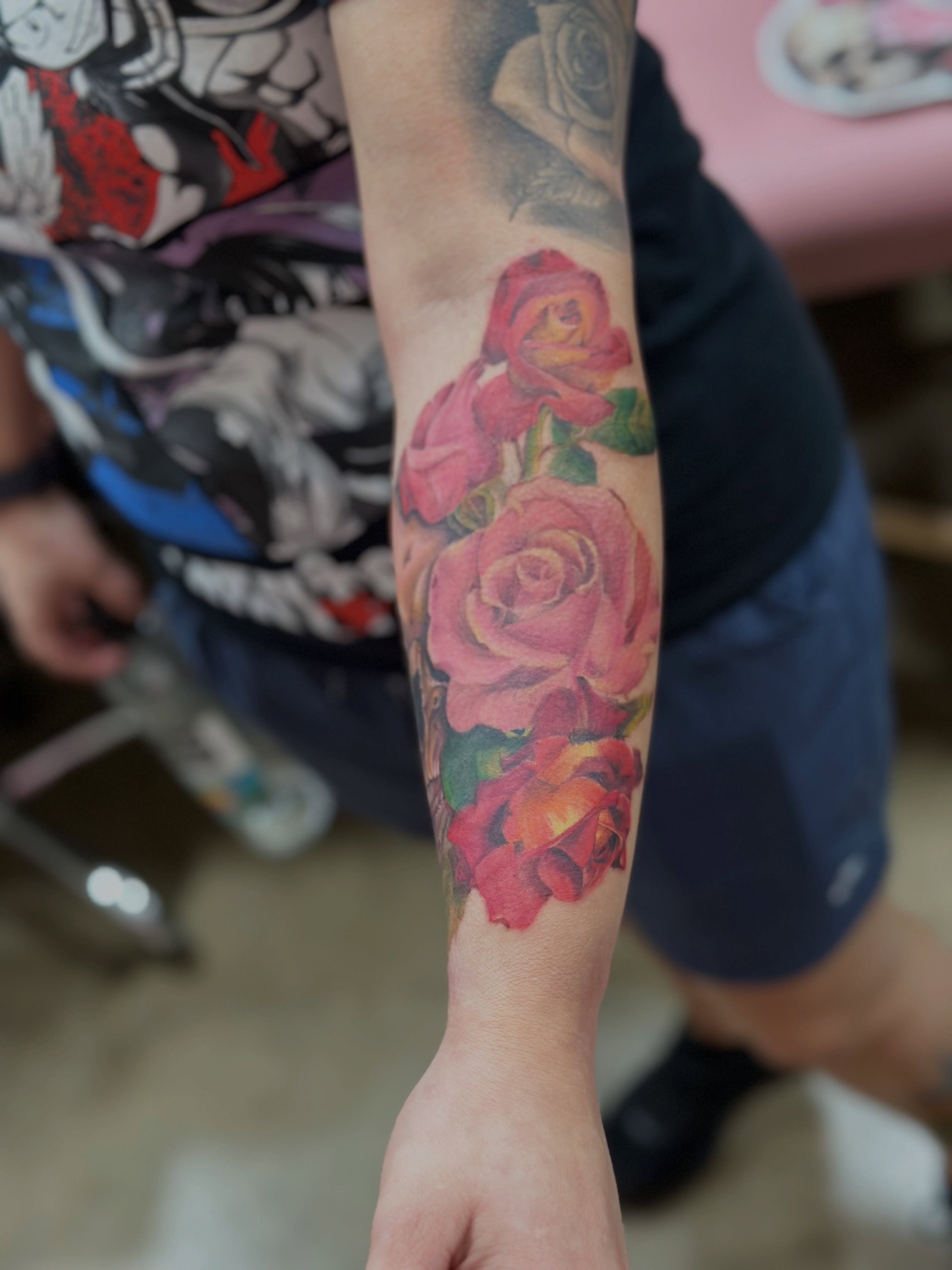 Roses realism tattoo on the forearm by Elizabeth’s Eclectic Tattoos