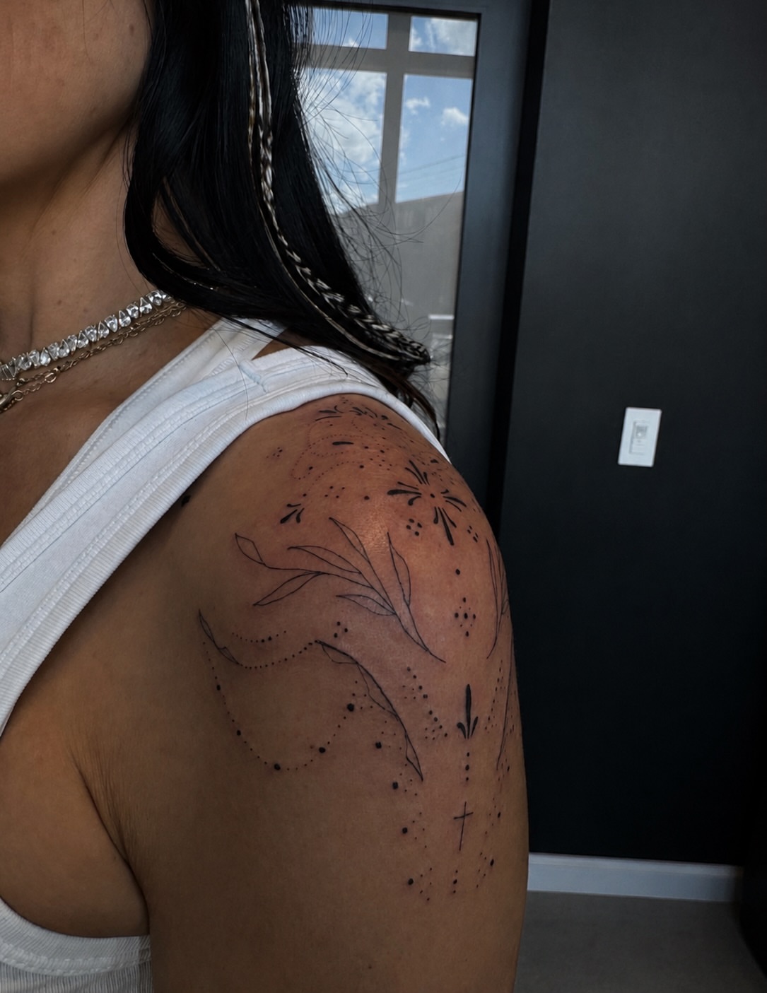 Floral design dotwork tattoo on the shoulder by Ryleigh Benjamin