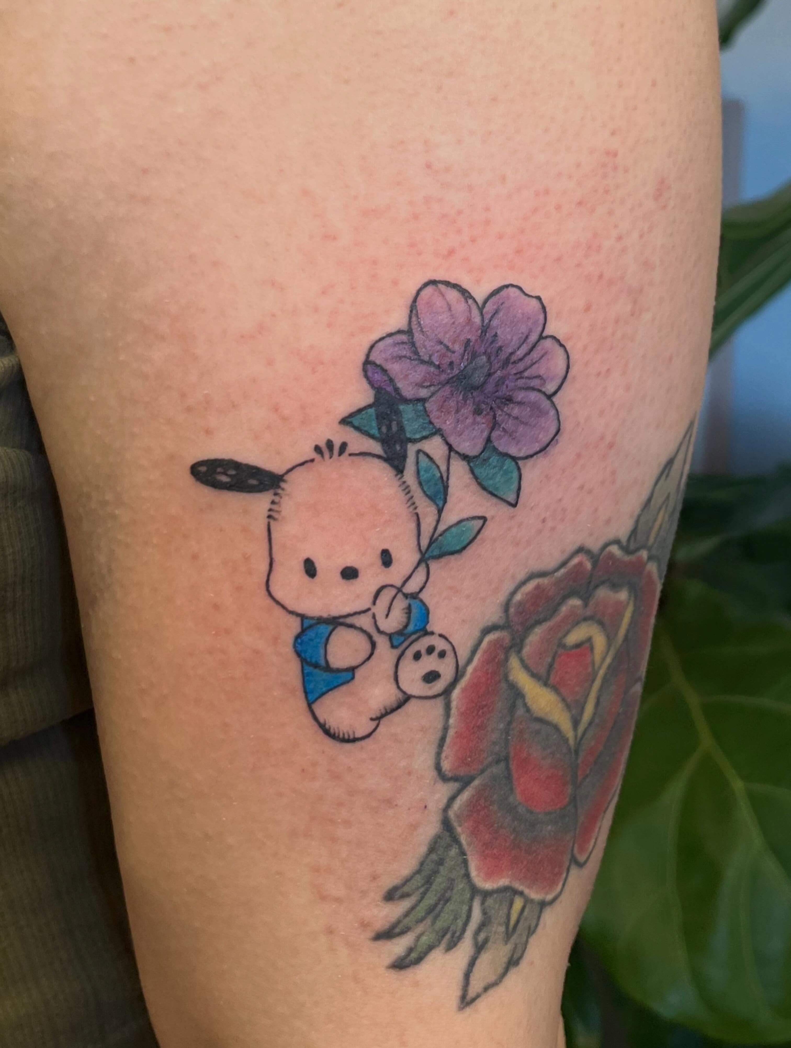 Baby with flowers new school tattoo on the thigh by Garden Glow Tattoo