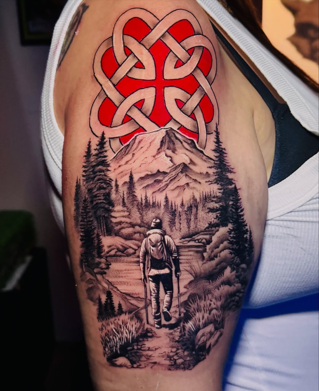 Dark art tattoo on the upper arm by Jarrod Gatzke