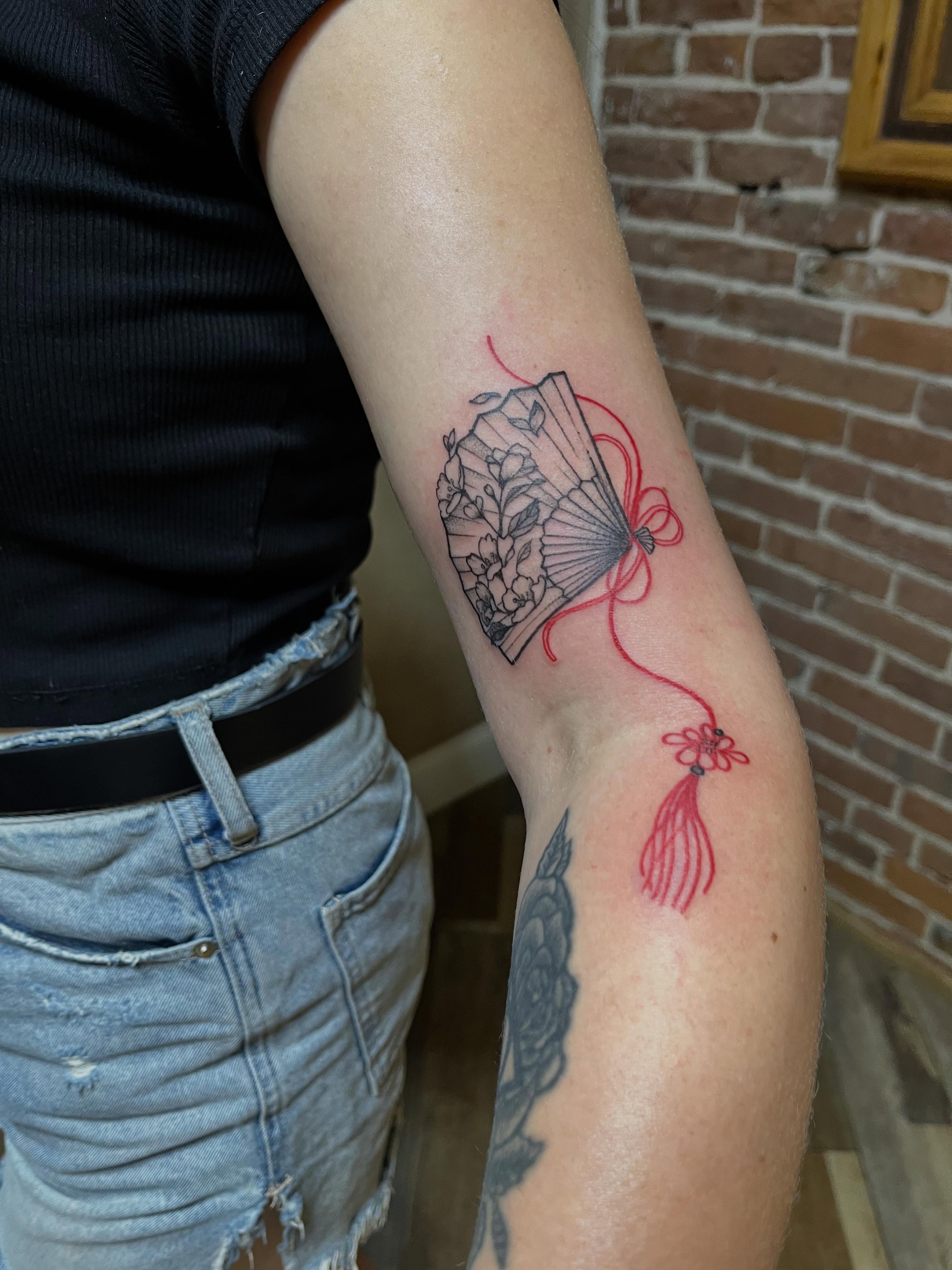 Fan with tassel geometric tattoo on the forearm by Tattoo Artist, Kansas City, Missouri
