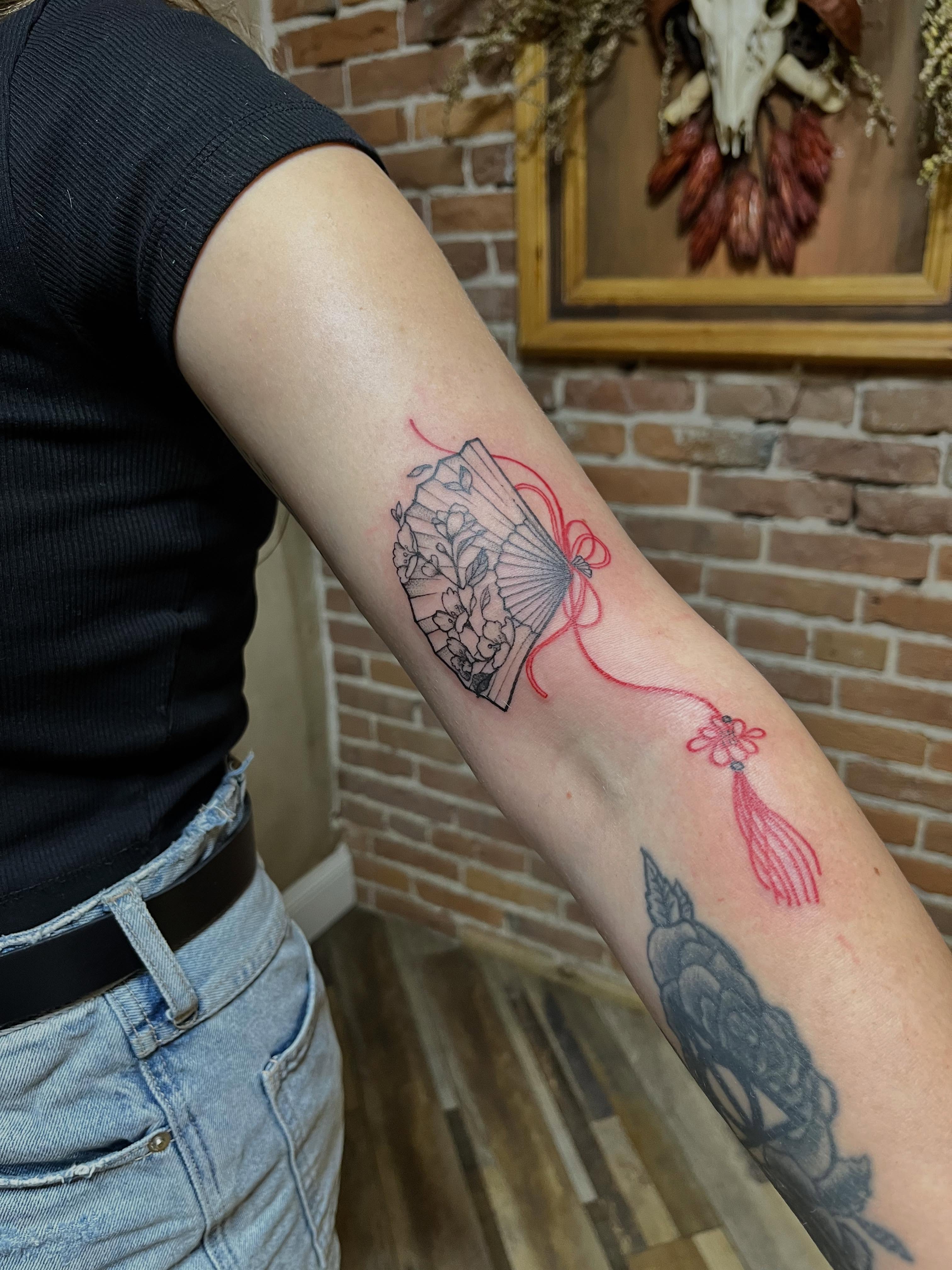 Fan with floral design dotwork tattoo on the forearm by Tattoo Artist, Kansas City, Missouri