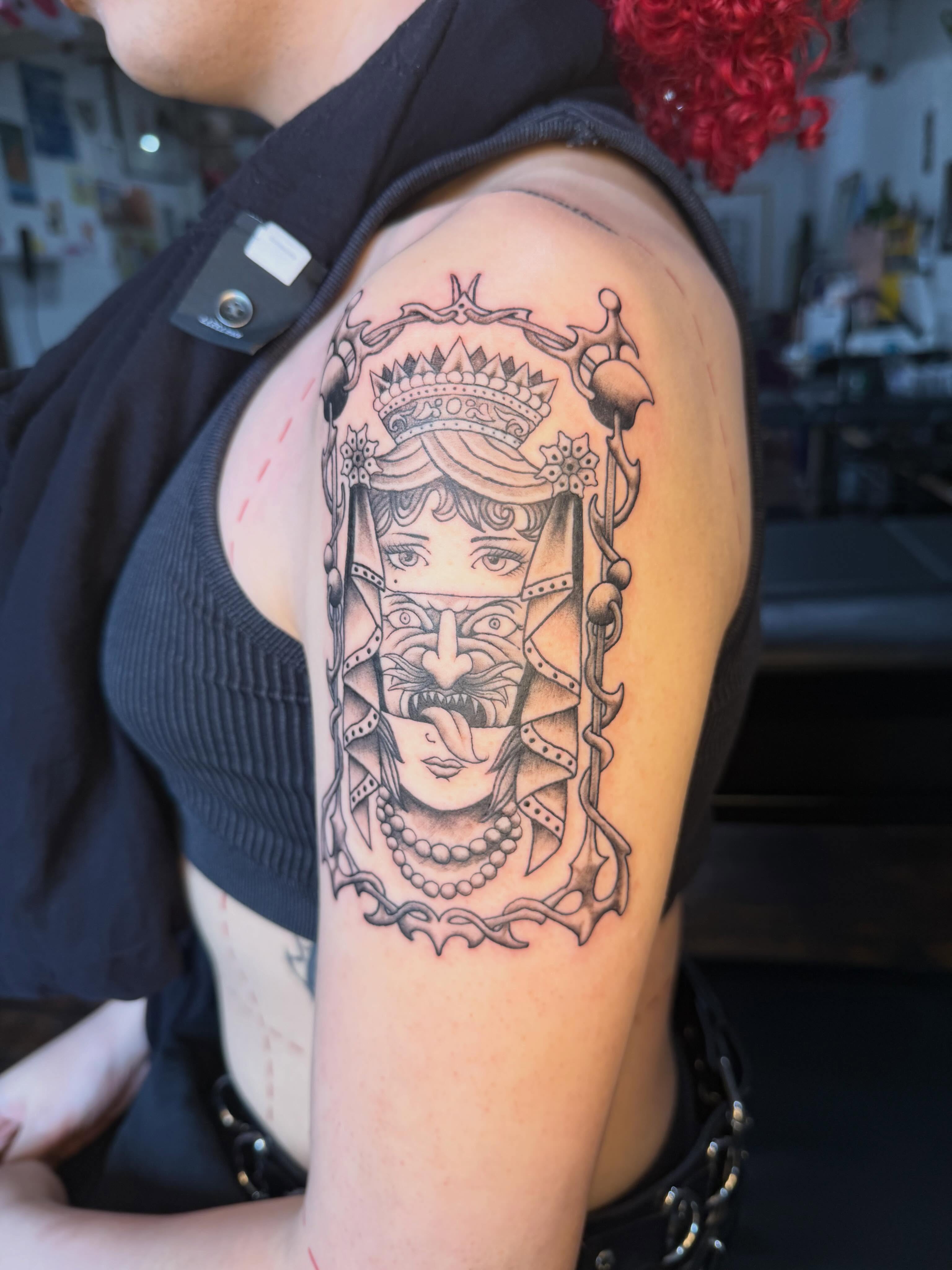 Woman with crown realism tattoo on the shoulder by Mike Nappi