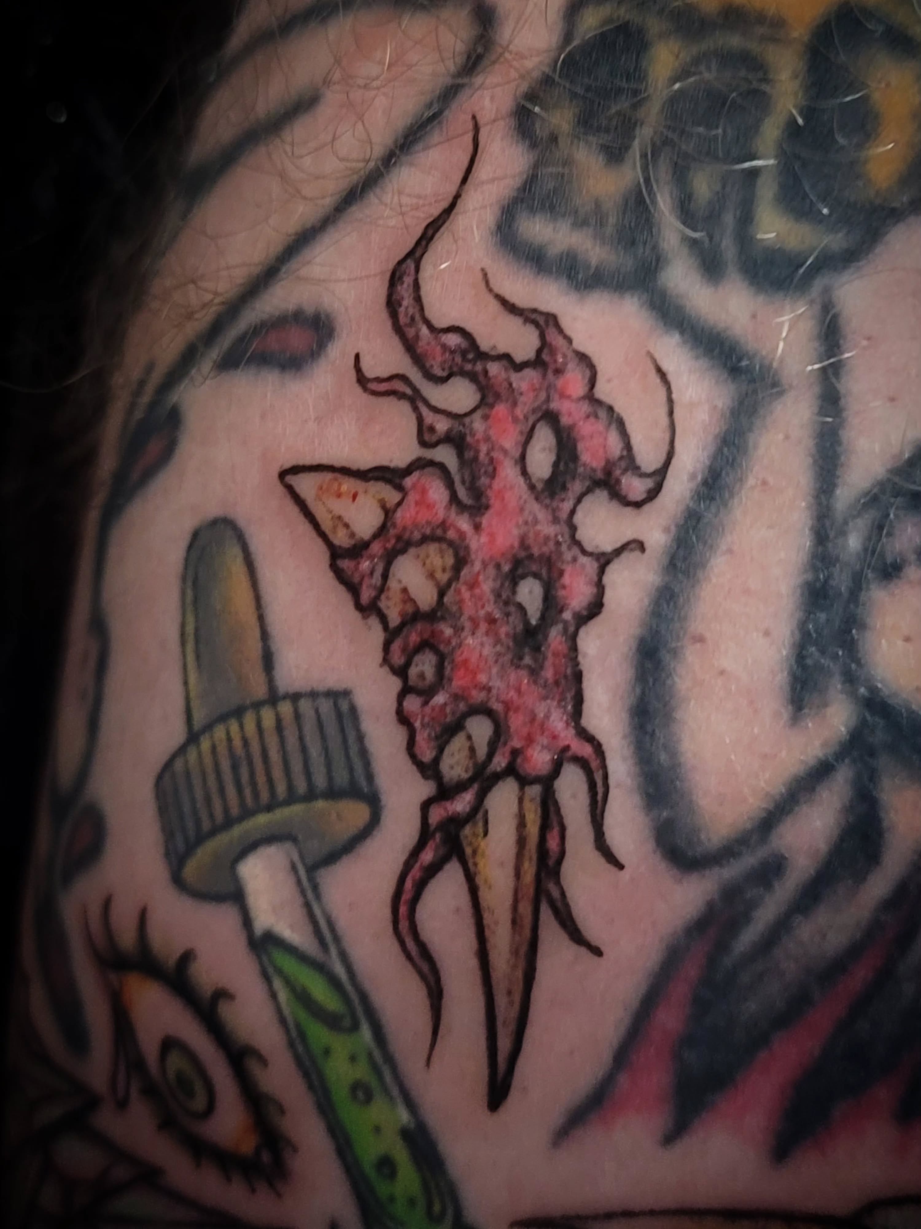 Squid-like creature American traditional tattoo on the shoulder by brockton a f 💀