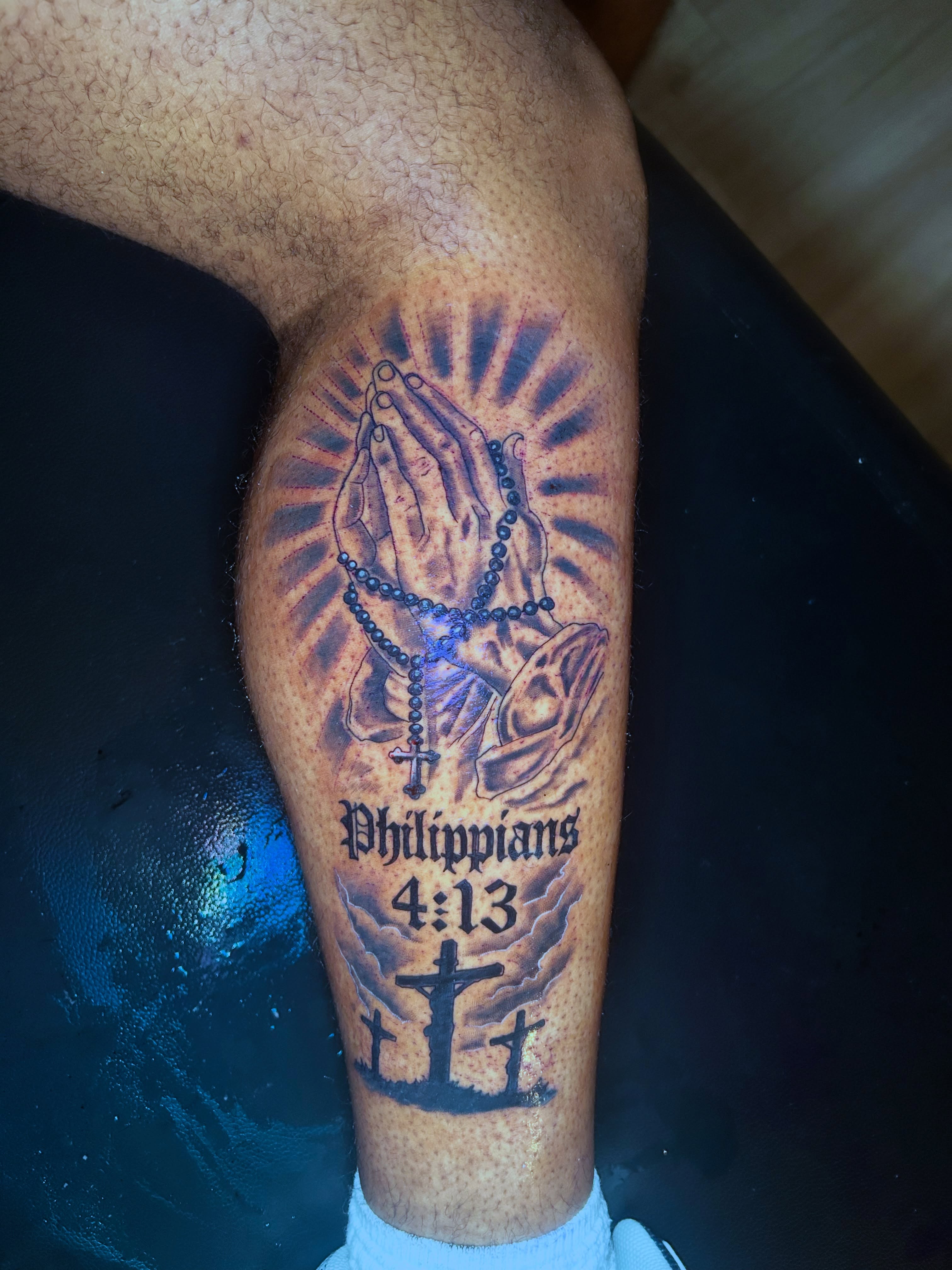 Praying hands with rosary black and grey tattoo on the leg by Tito Cross ❤️‍🔥