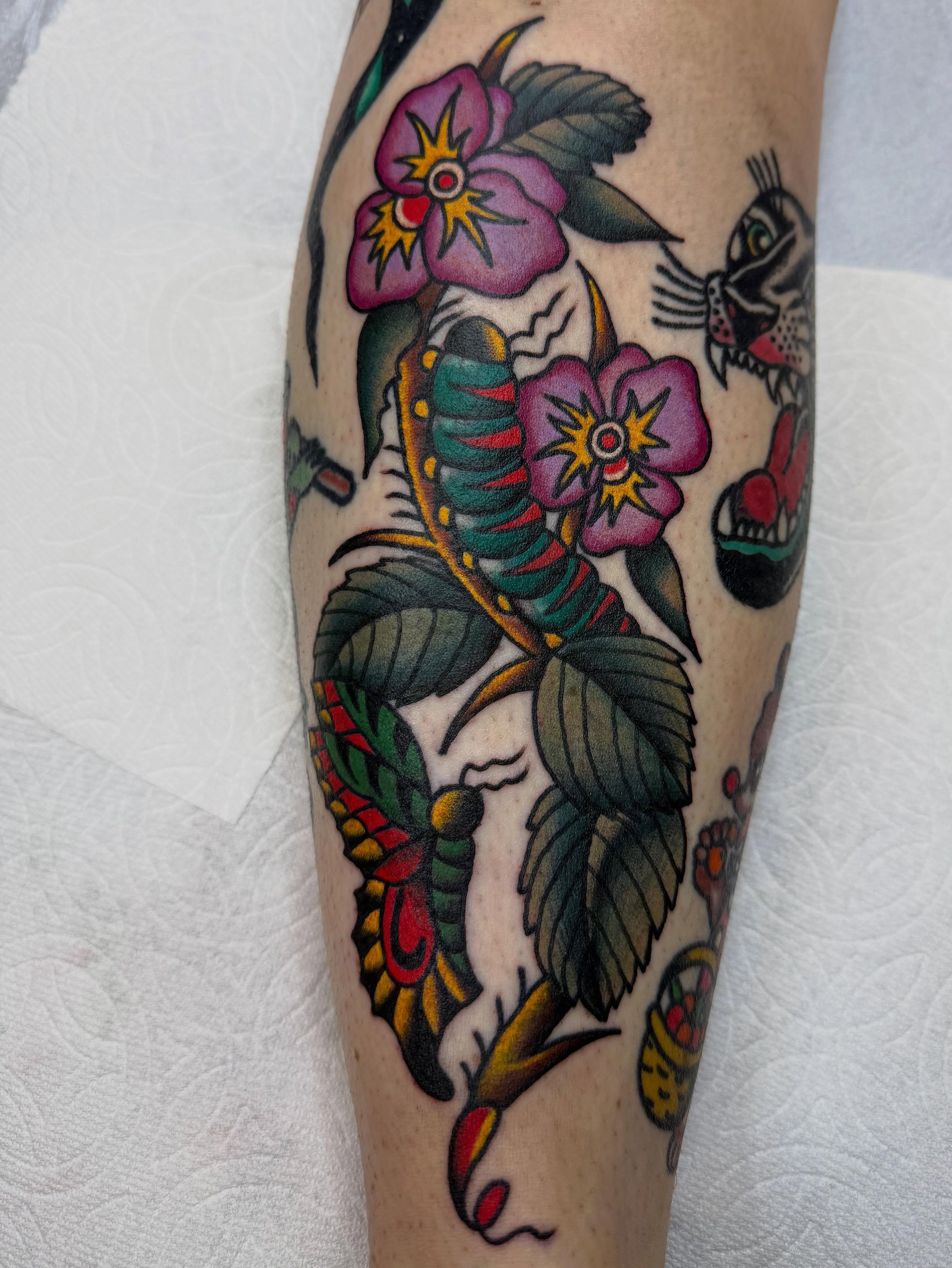 Bird and flowers American traditional tattoo on the forearm by Tanya Gomez