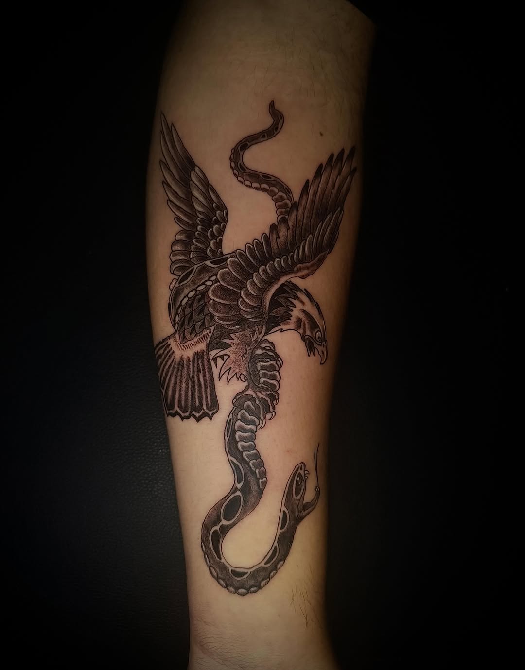 Eagle fighting snake realism tattoo on the forearm by MY$T