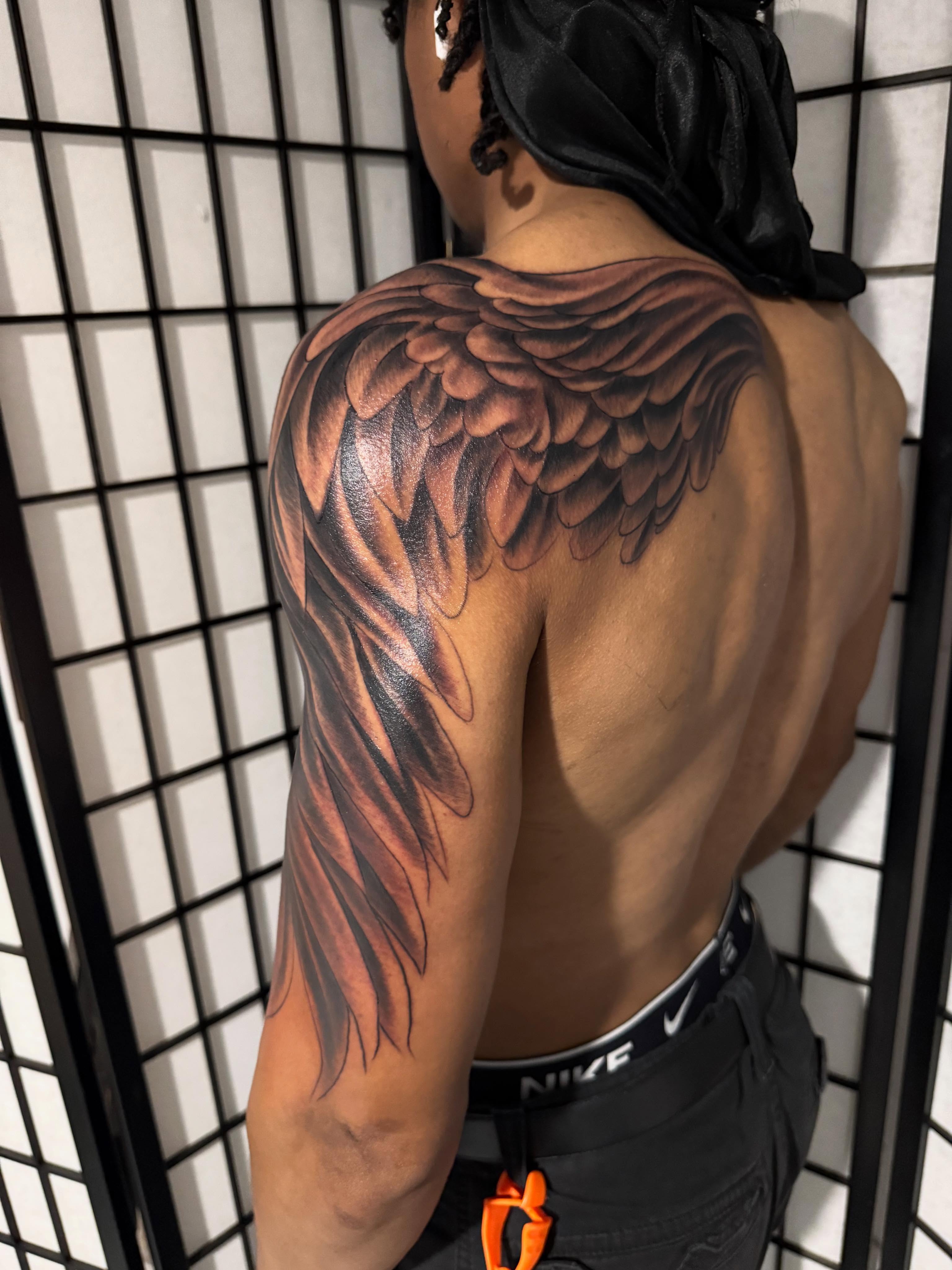 Wing realism tattoo on the shoulder by Randall Croley El