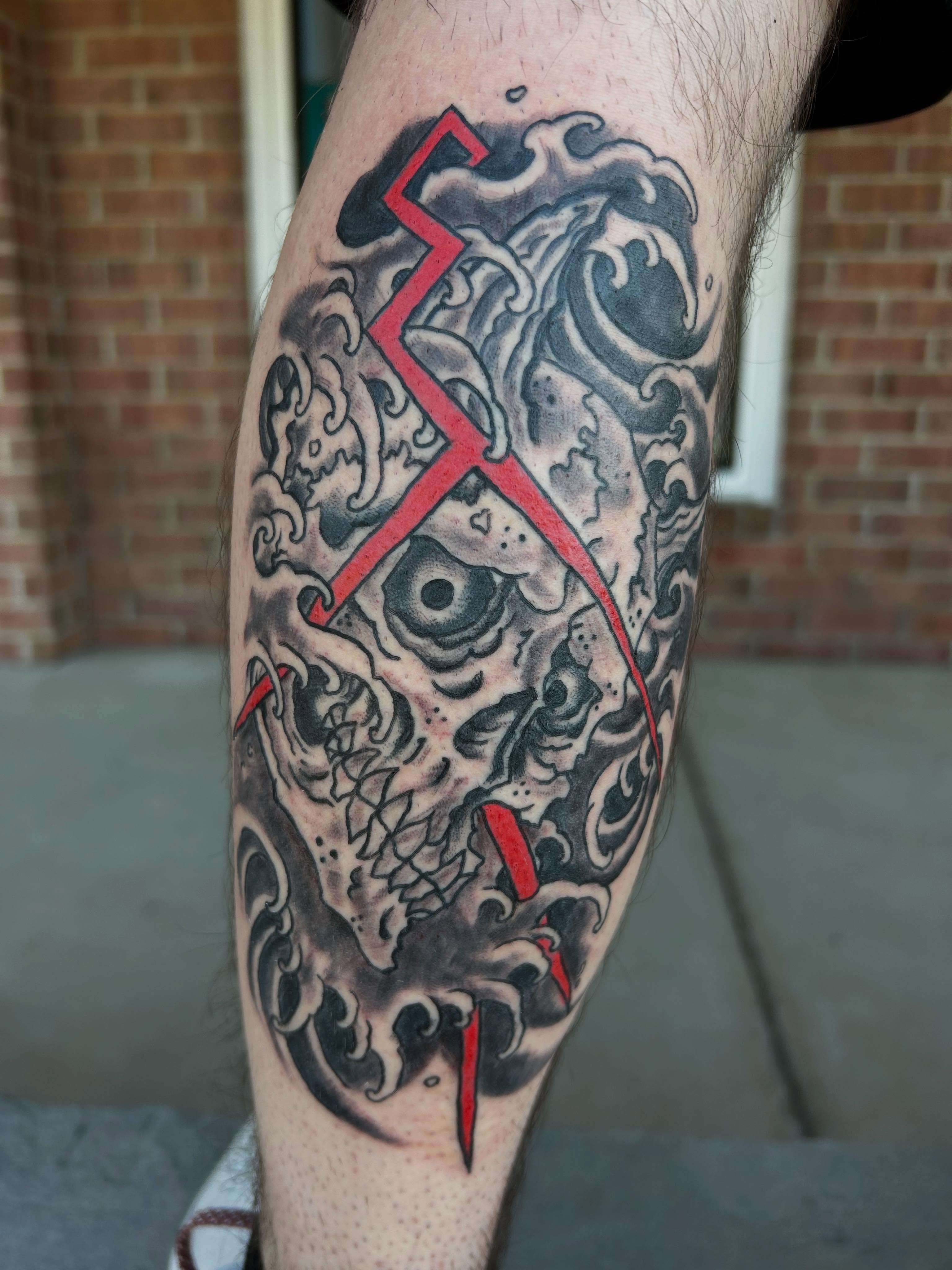 Wave and cross japanese irezumi tattoo on the forearm by Stogie Tony