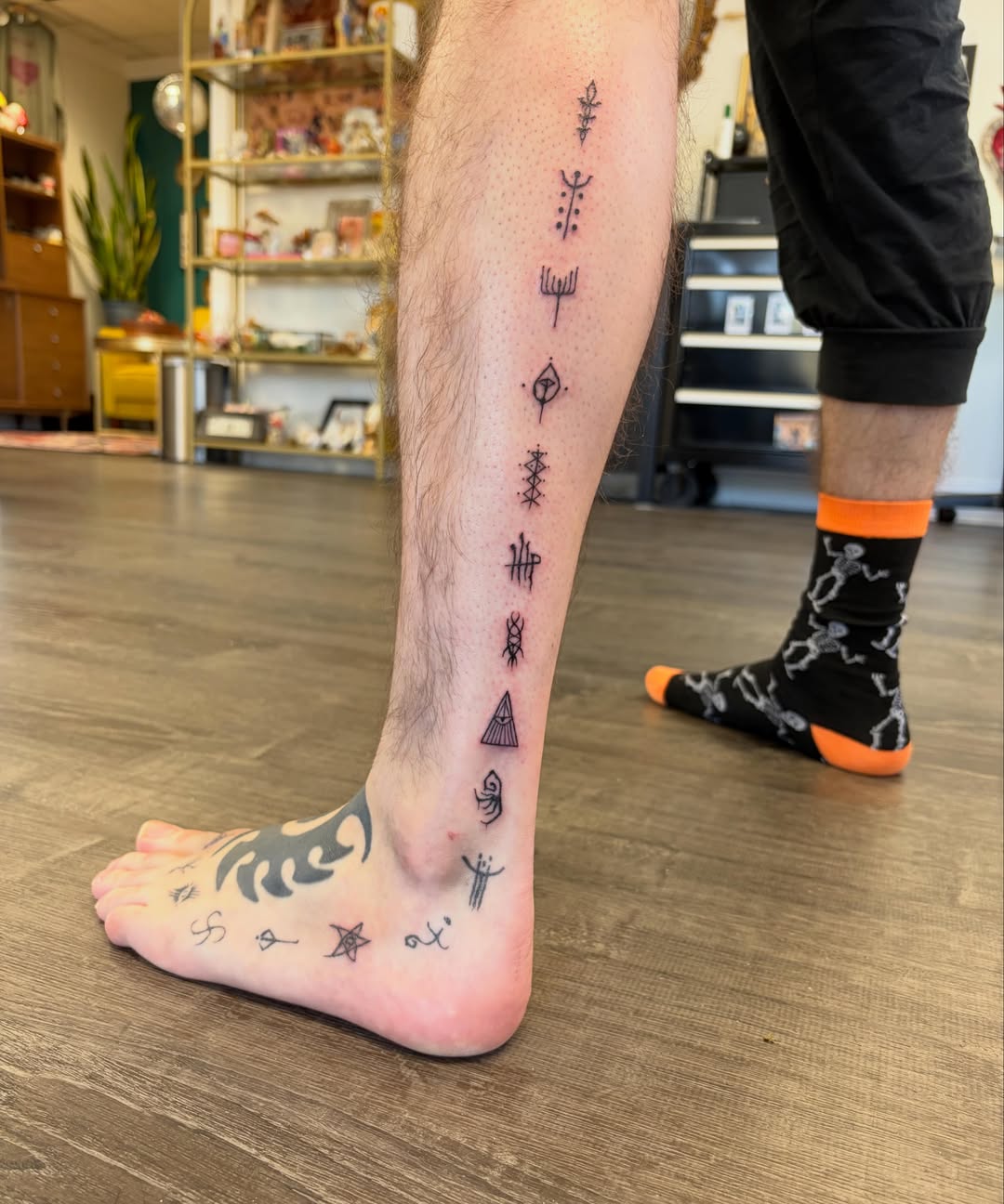Ancient symbols geometric tattoo on the calf by Deni Carolina