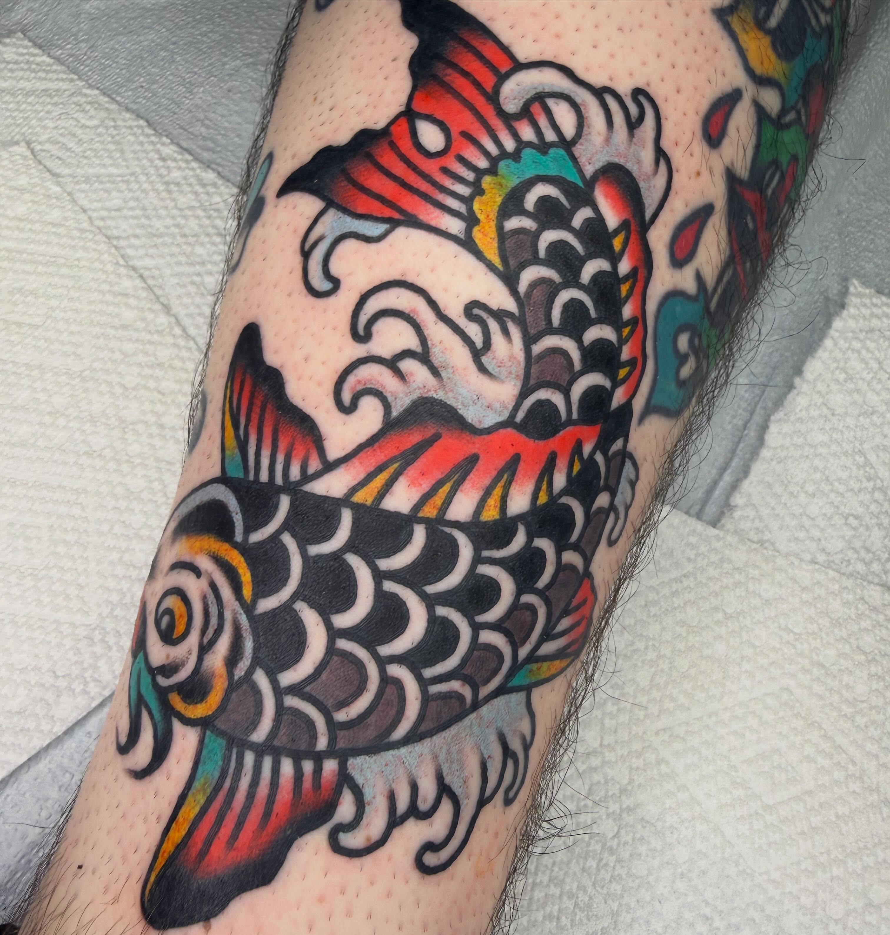 Koi fish American traditional tattoo on the forearm by Tyler