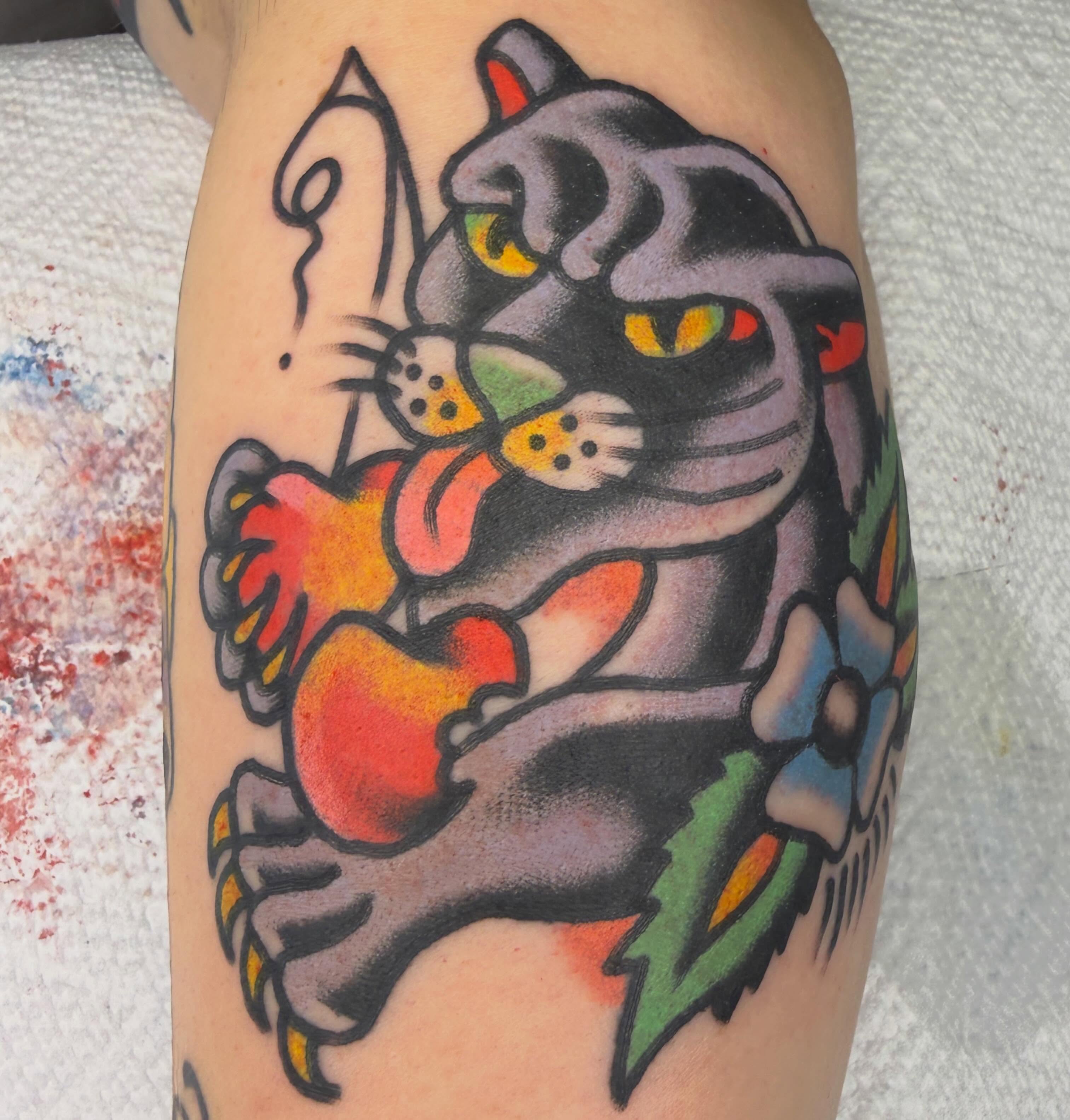 Cat American traditional tattoo on the forearm by Tyler