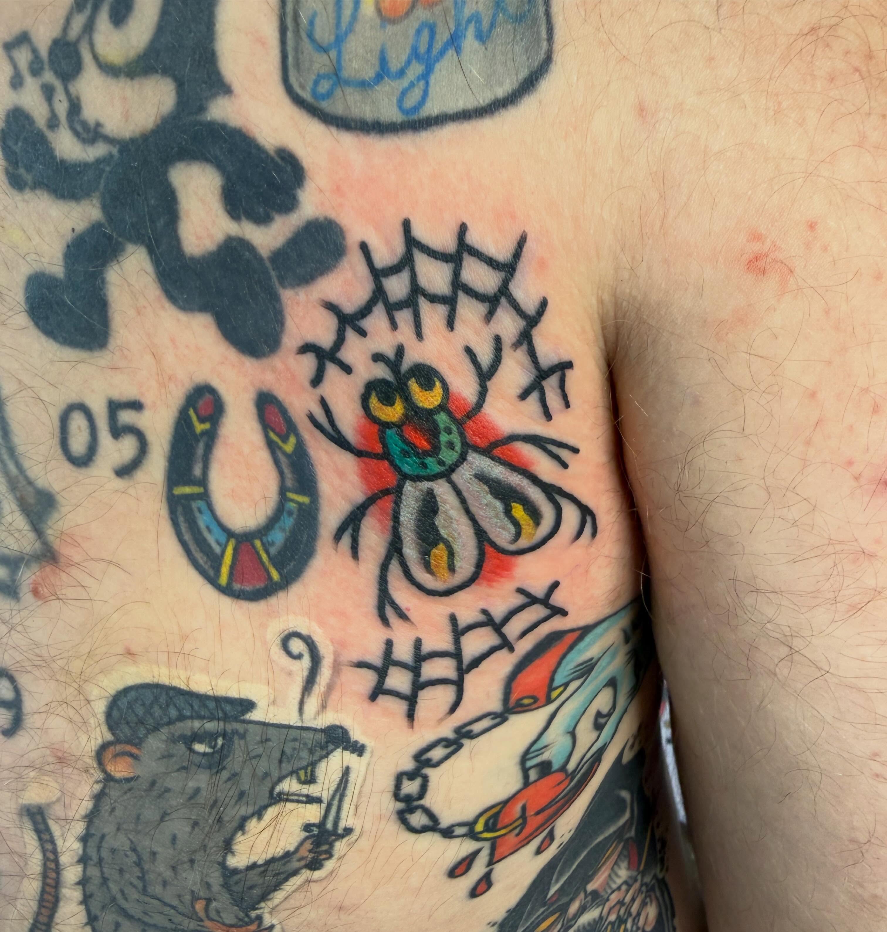 Spider American traditional tattoo on the chest by Tyler