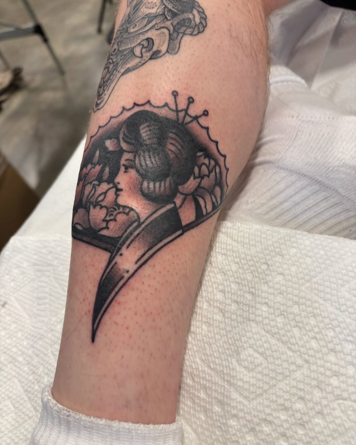 Woman with scythe American traditional tattoo on the forearm by Cody Wallenius, Merrillville, Indiana
