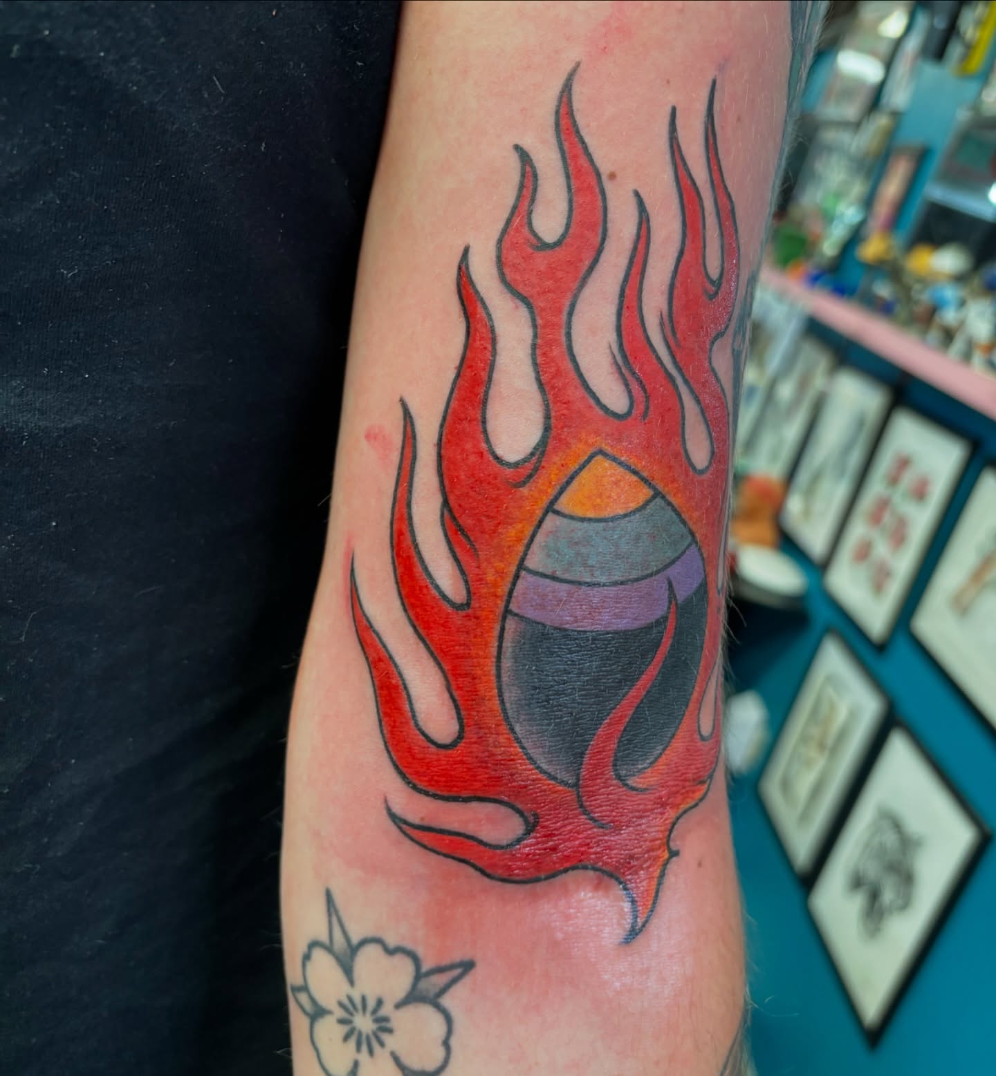 Flame with eye neo-traditional tattoo on the forearm by Cody Wallenius, Merrillville, Indiana