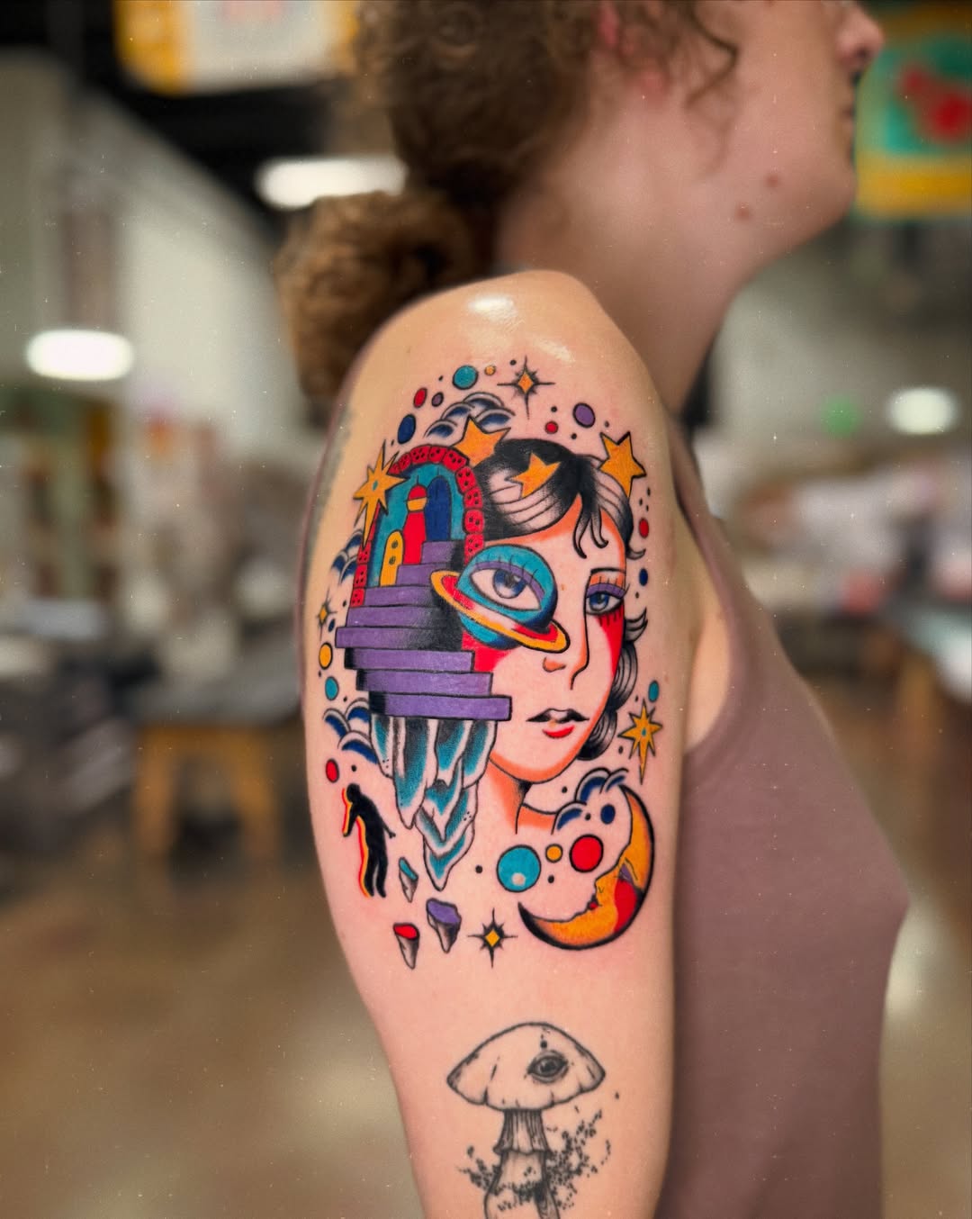 Space-themed portrait new school tattoo on the upper arm by charlie
