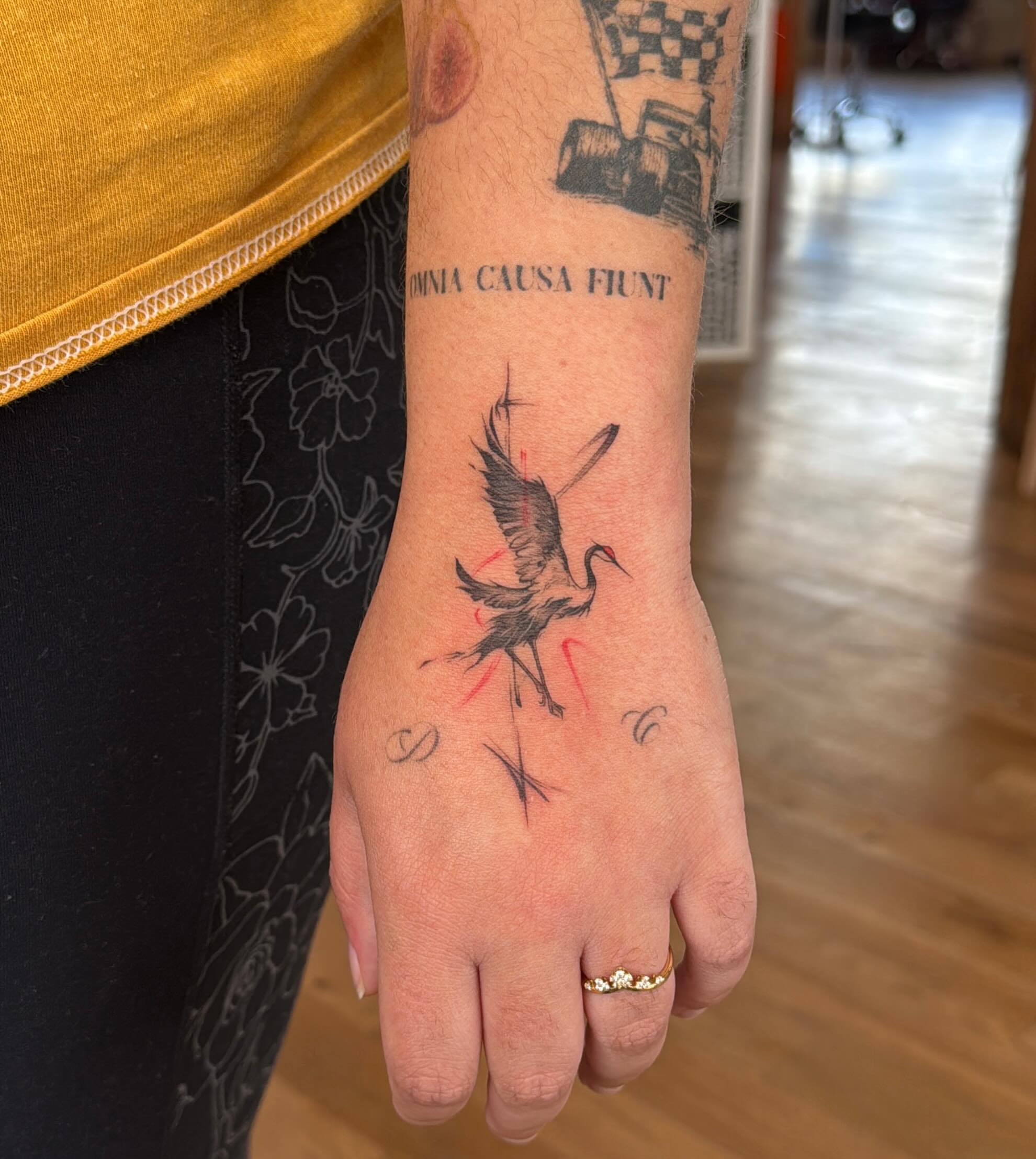 Heron realism tattoo on the hand by Ethan