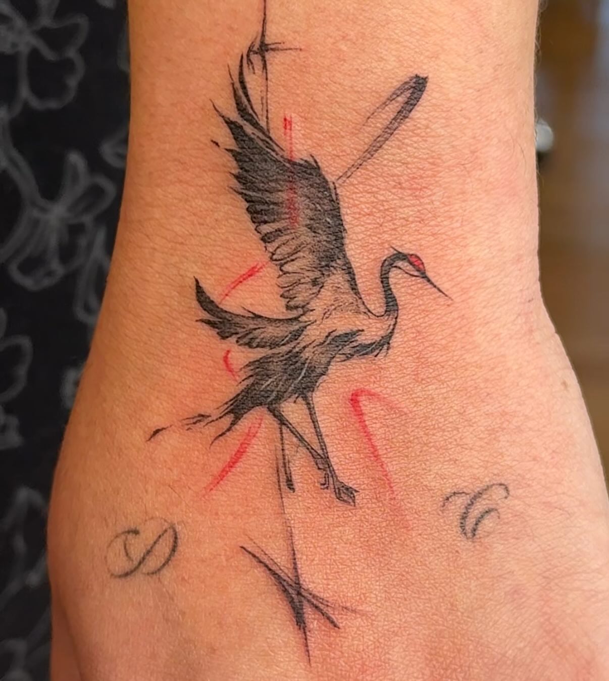 Crane black and grey tattoo on the forearm by Ethan