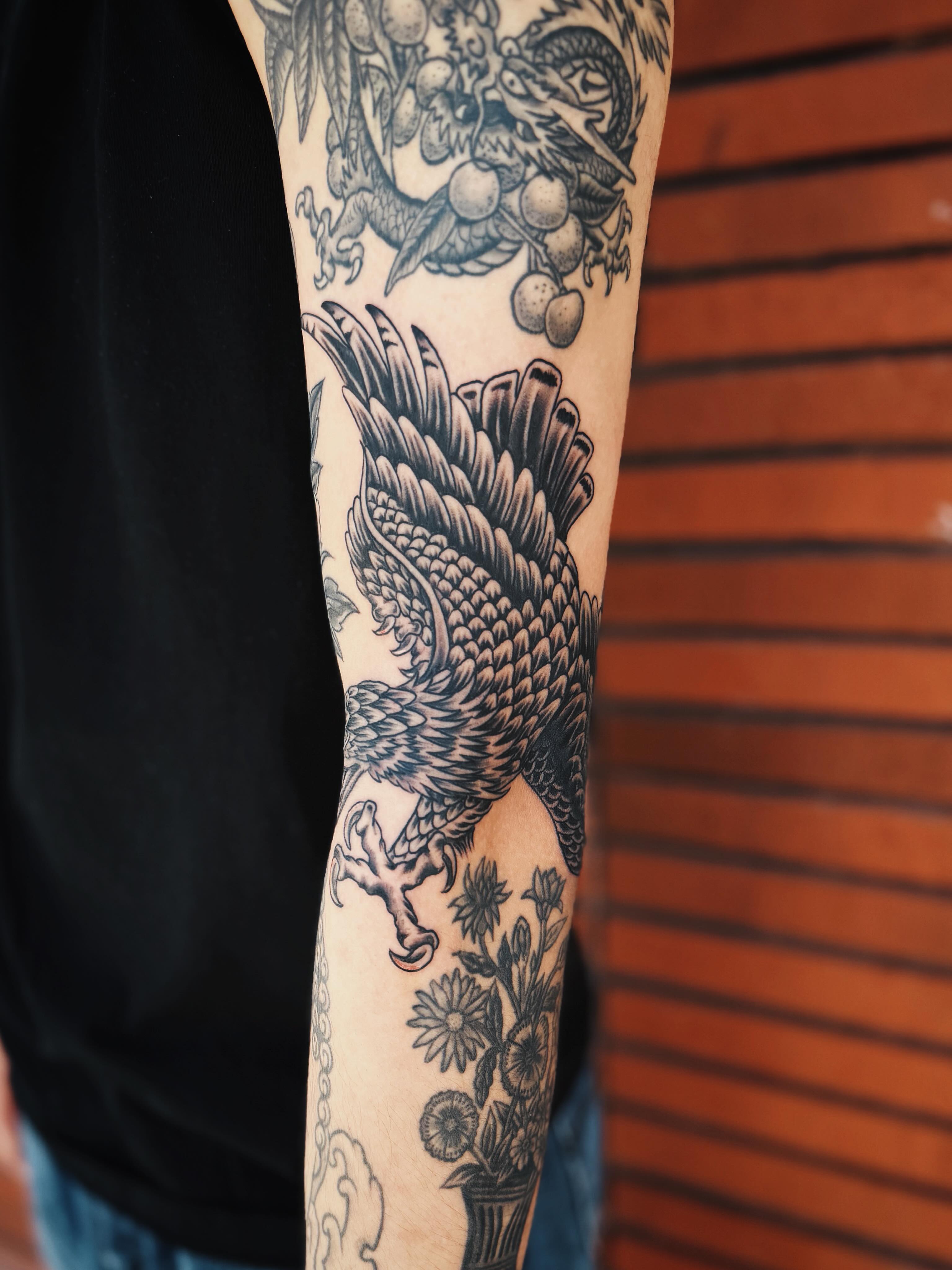 Eagle black and grey tattoo on the forearm by @amandahowtattoo