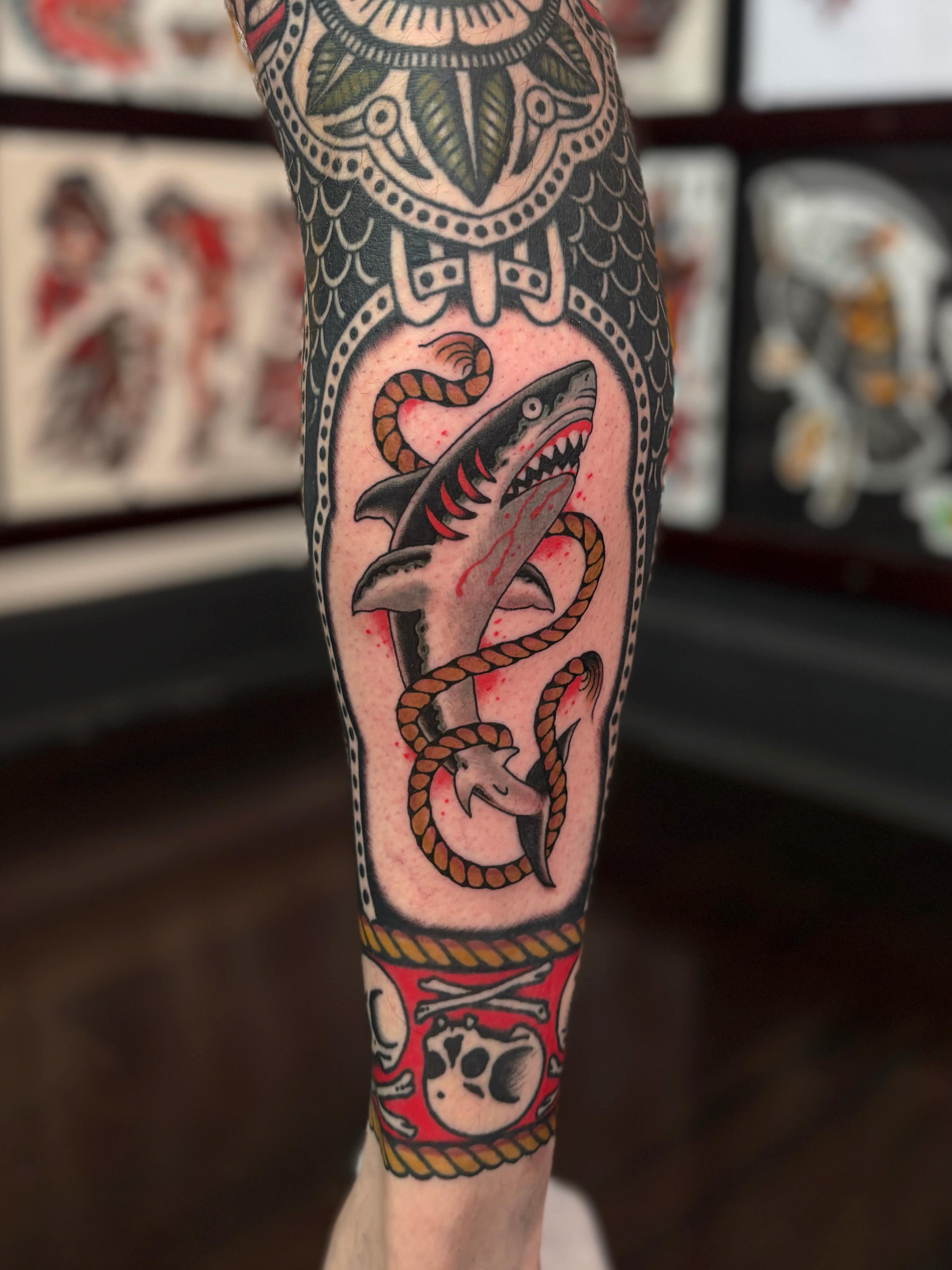 Shark and snake American traditional tattoo on the forearm by Jesse Smith, Chicago, Illinois
